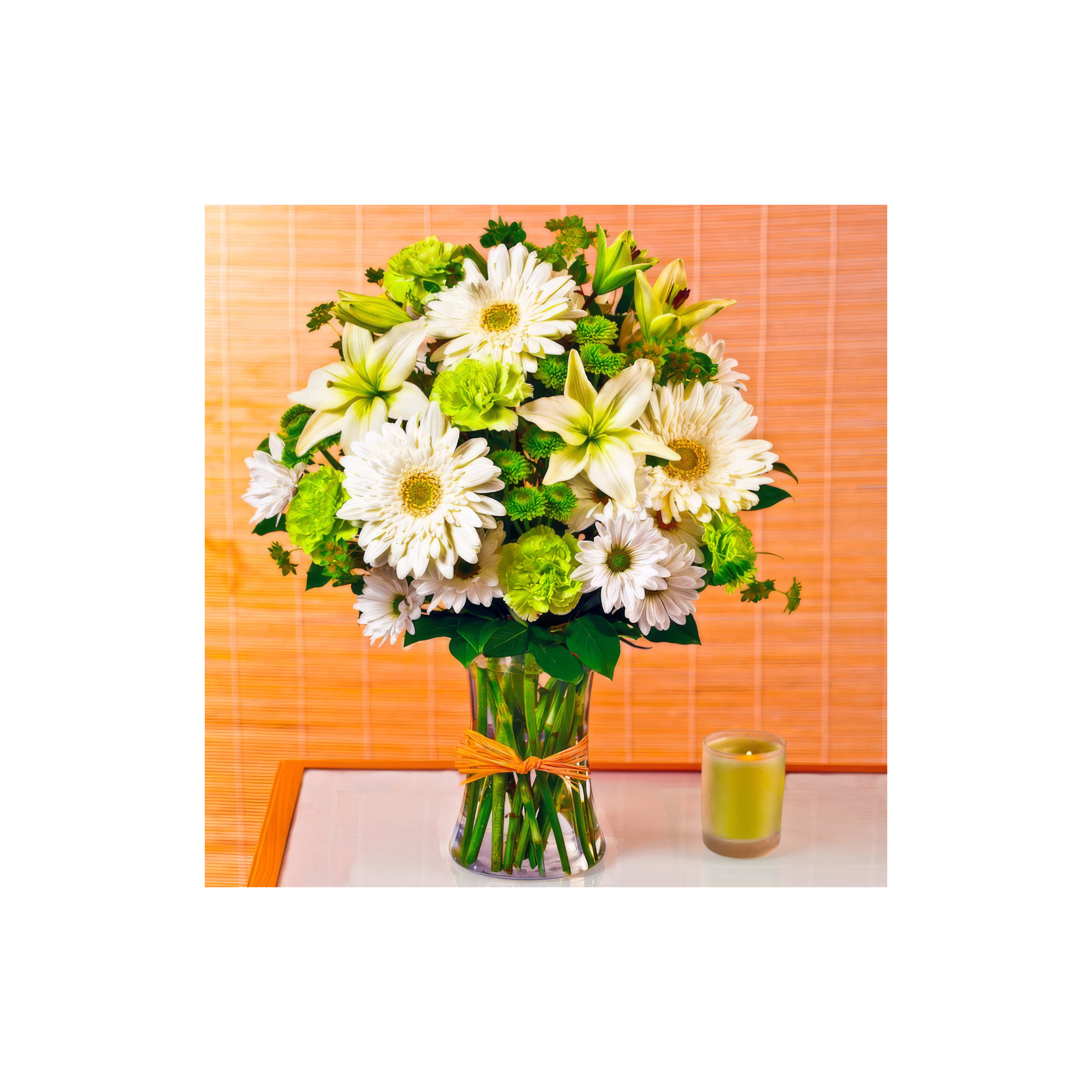 Fresh white and green flowers arranged in a vibrant bouquet beside a soft candle.