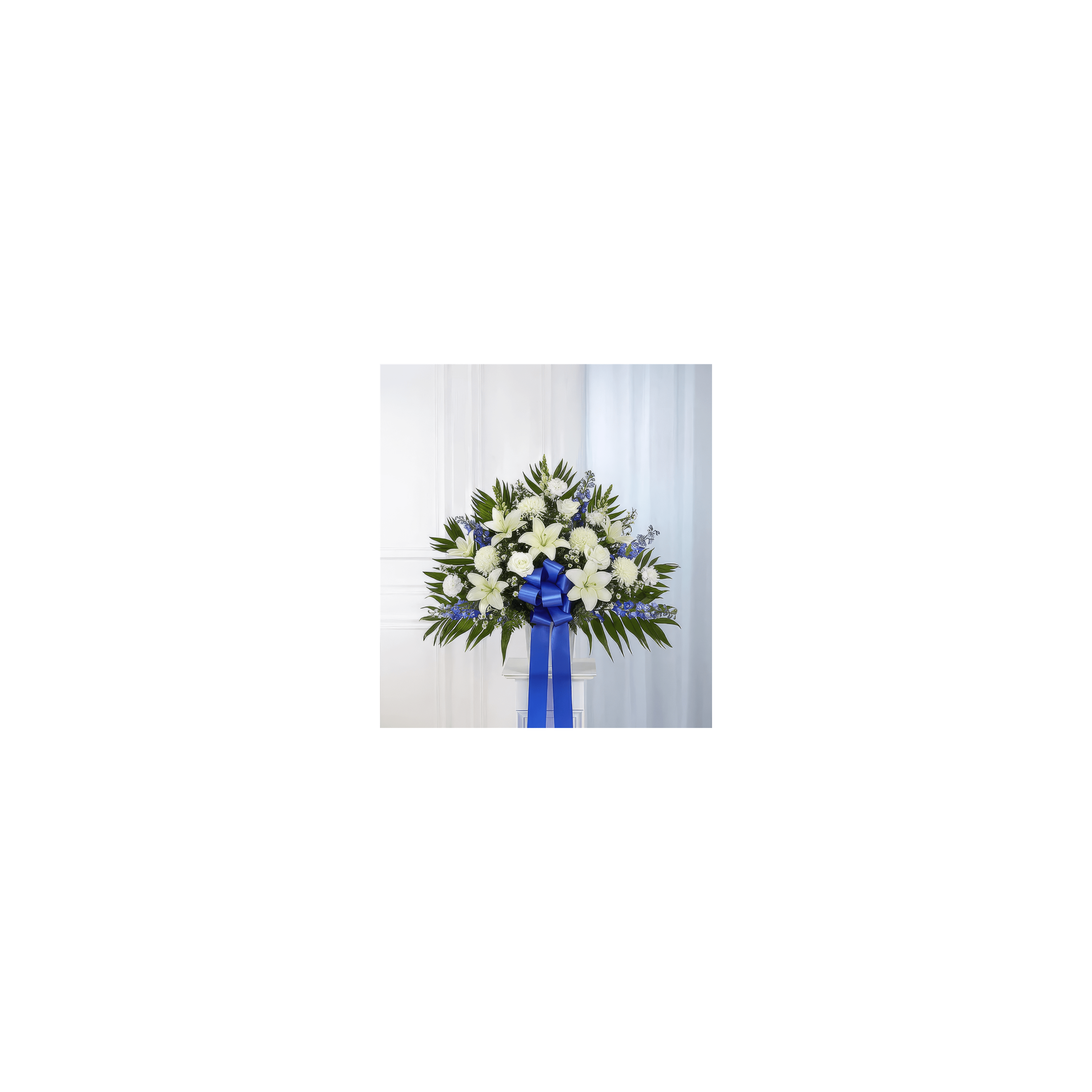 A vibrant display of white lilies and blue flowers arranged beautifully for any celebration.