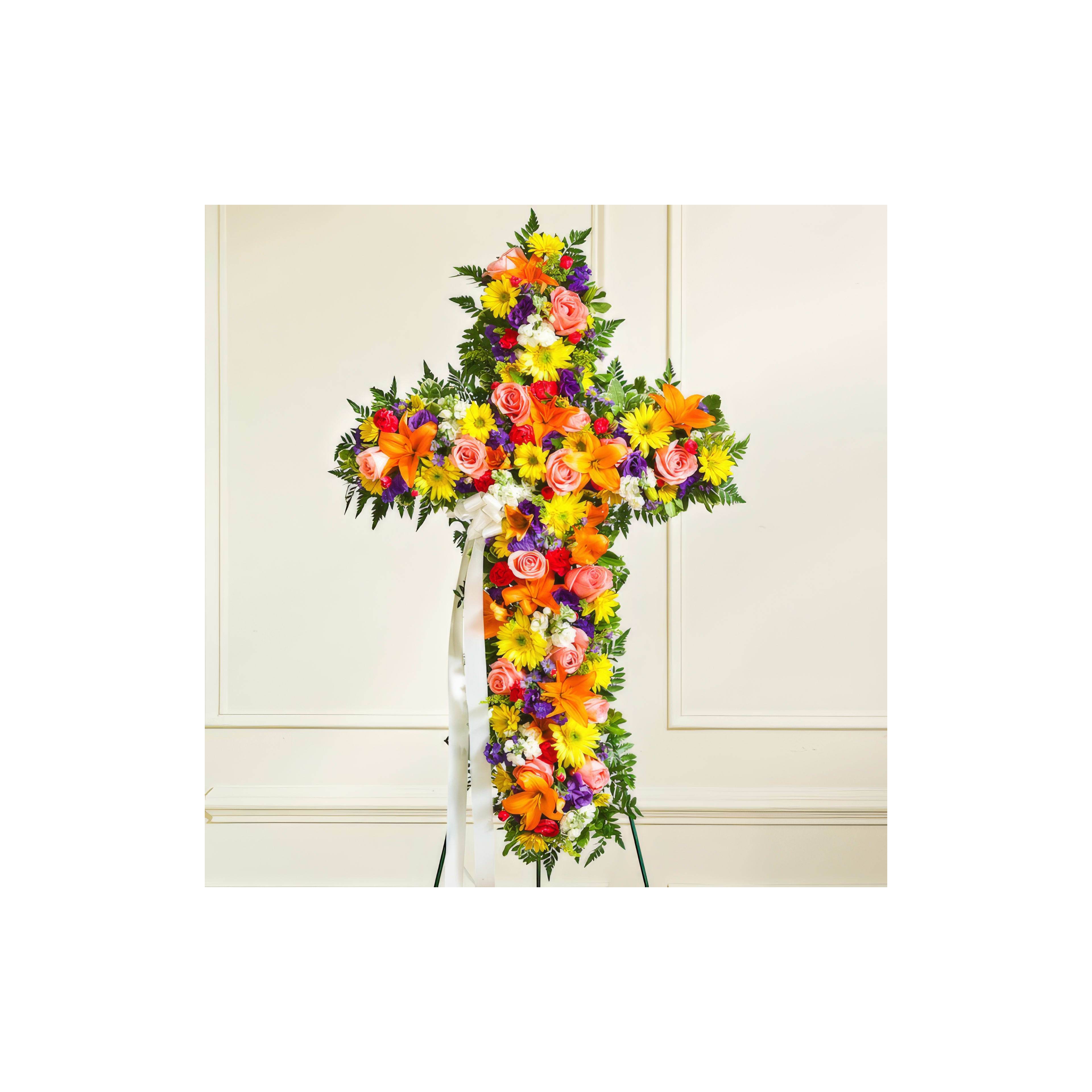 A vibrant flower cross serves as a tribute at the memorial gathering.
