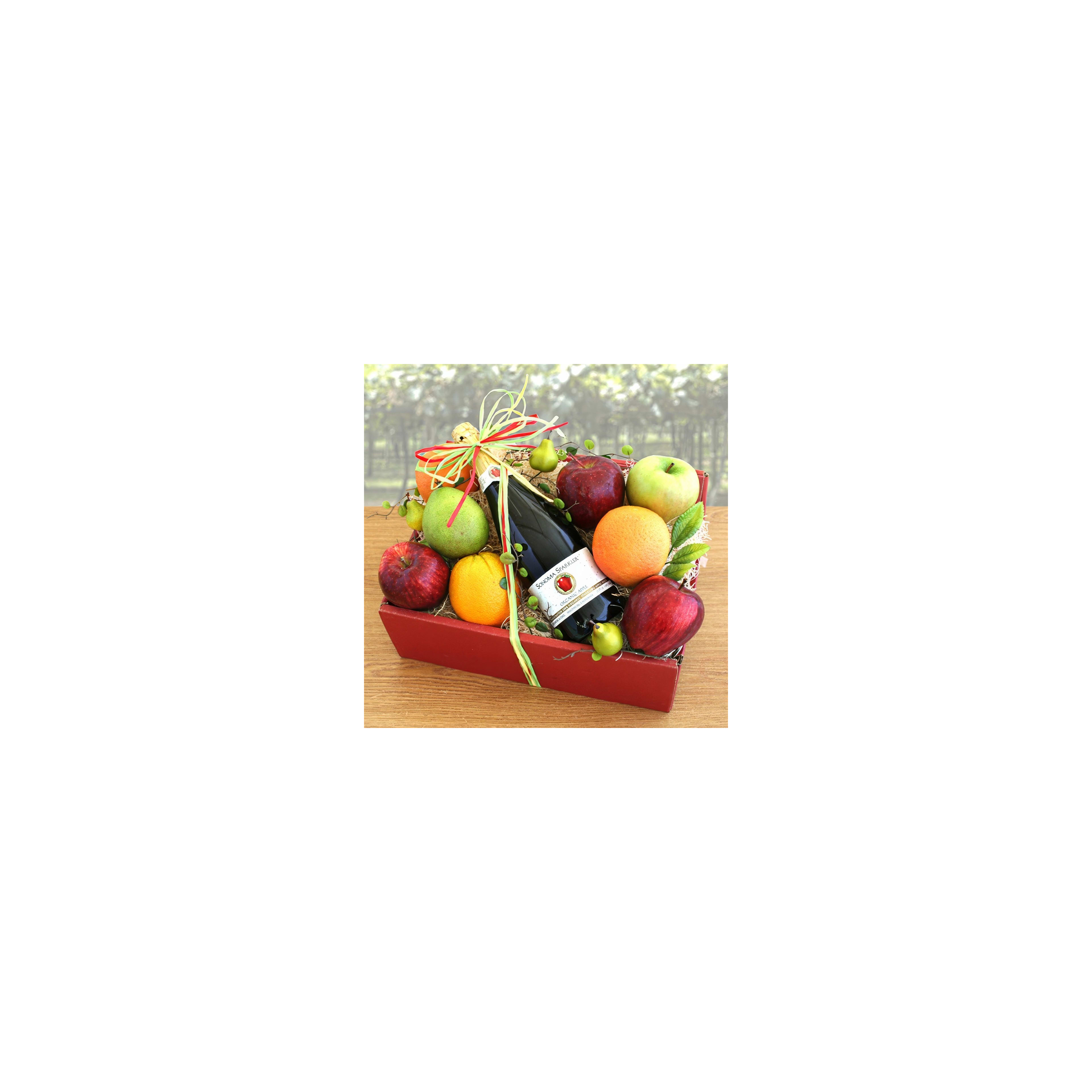 A colorful arrangement of fresh fruits and a sparkling drink is presented in a decorative basket.