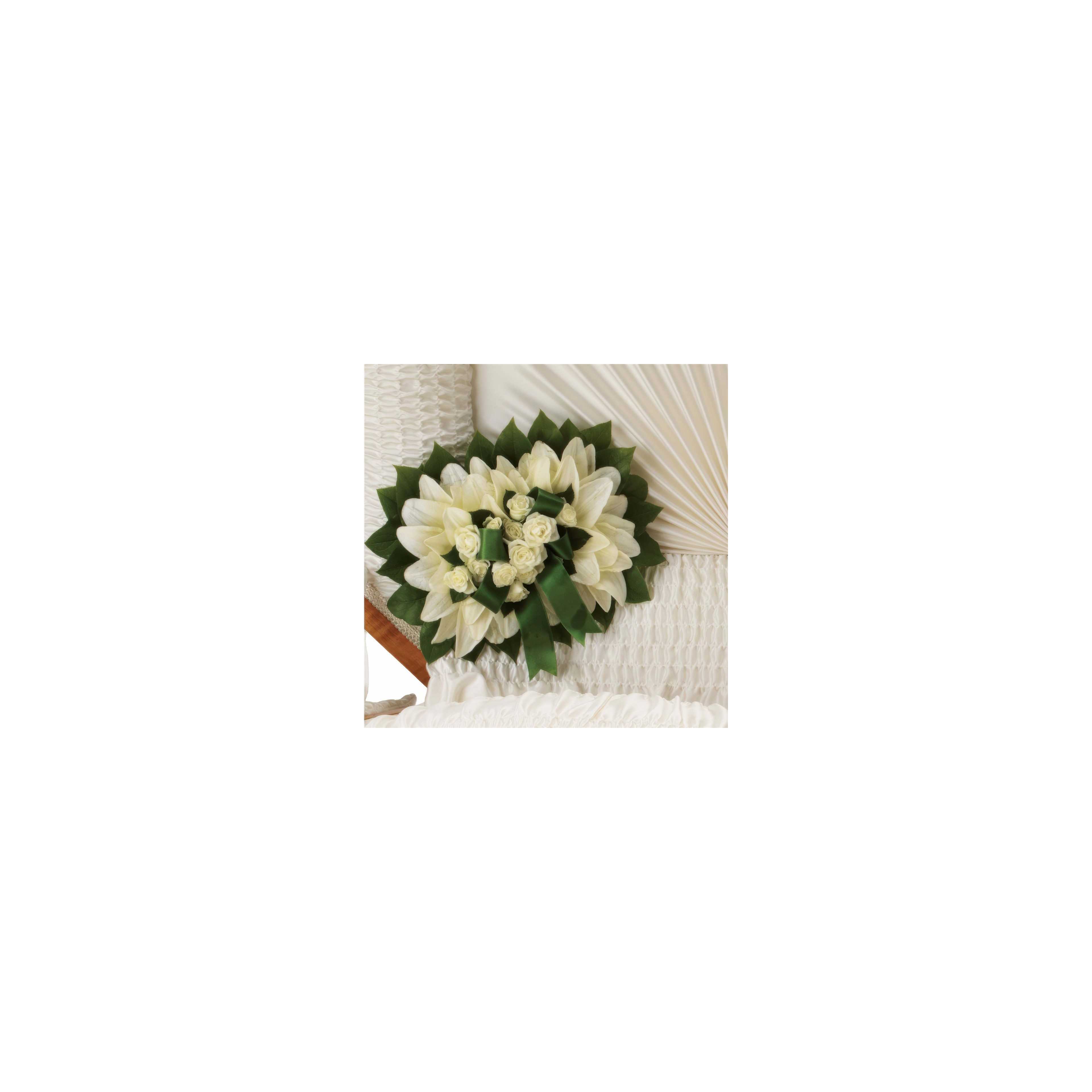 A delicate arrangement of white flowers and green leaves enhances the elegance of the wedding venue.