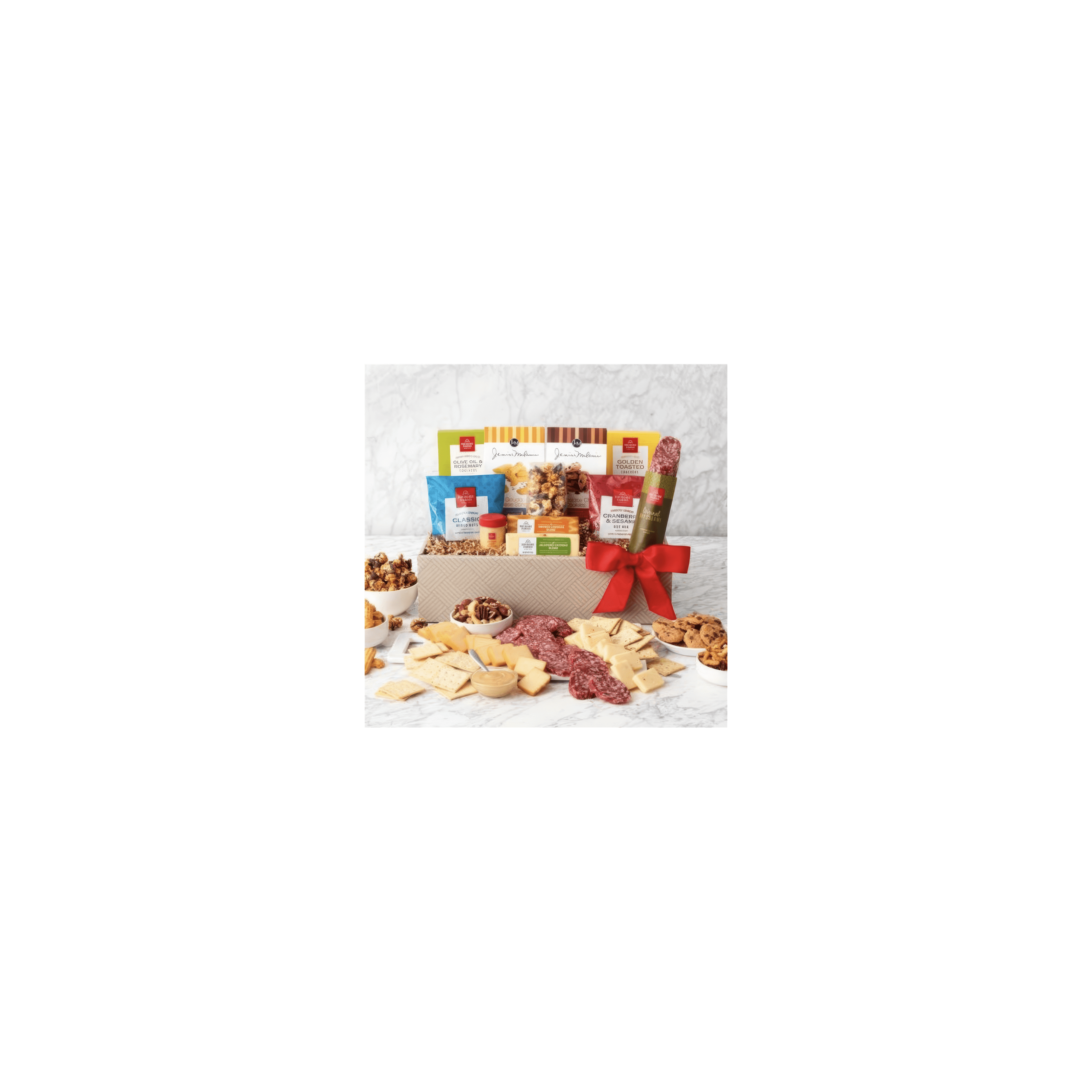 A beautifully arranged gift basket displays a variety of cheeses, cured meats, and snacks.