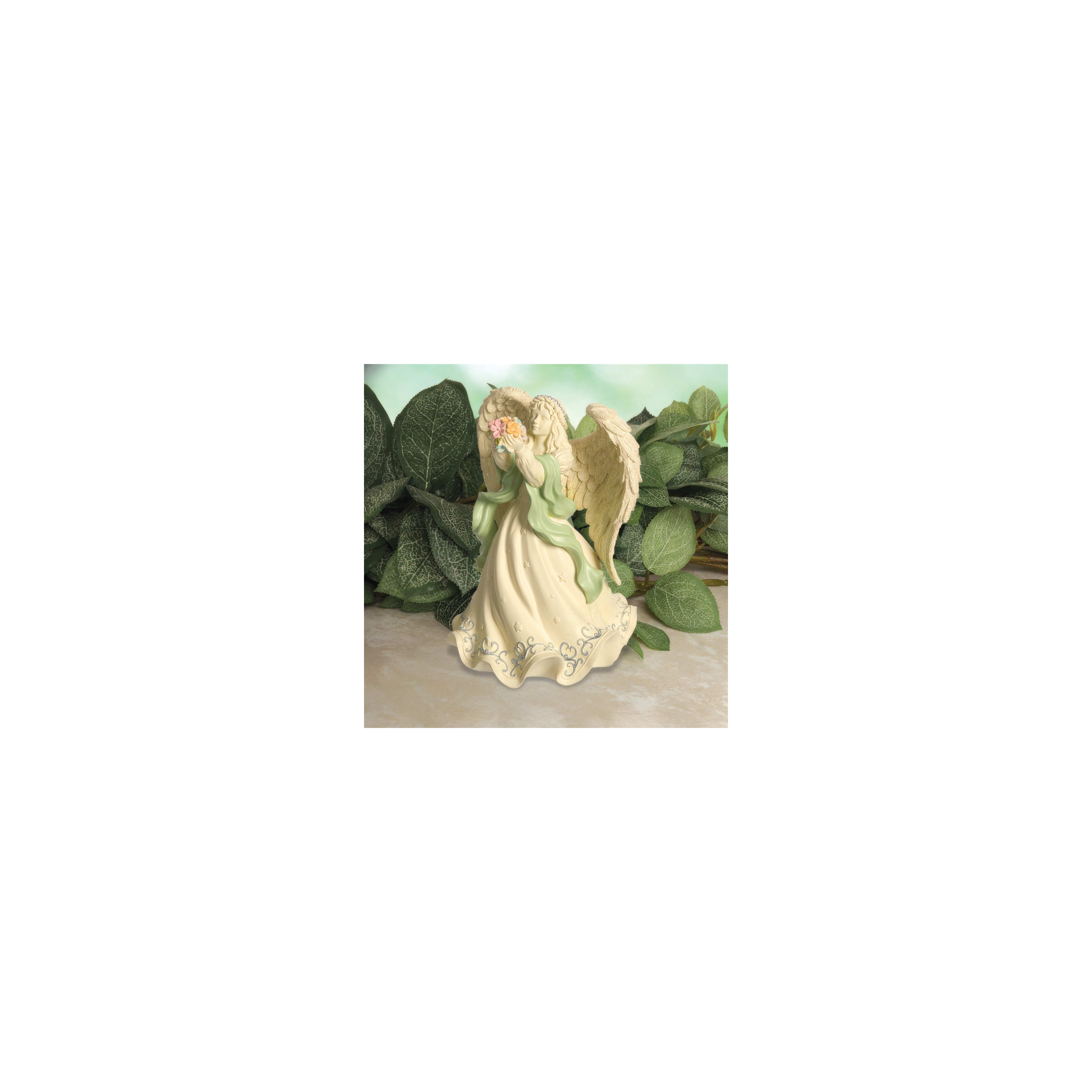 A decorative angel figurine gently holds flowers surrounded by lush green leaves.