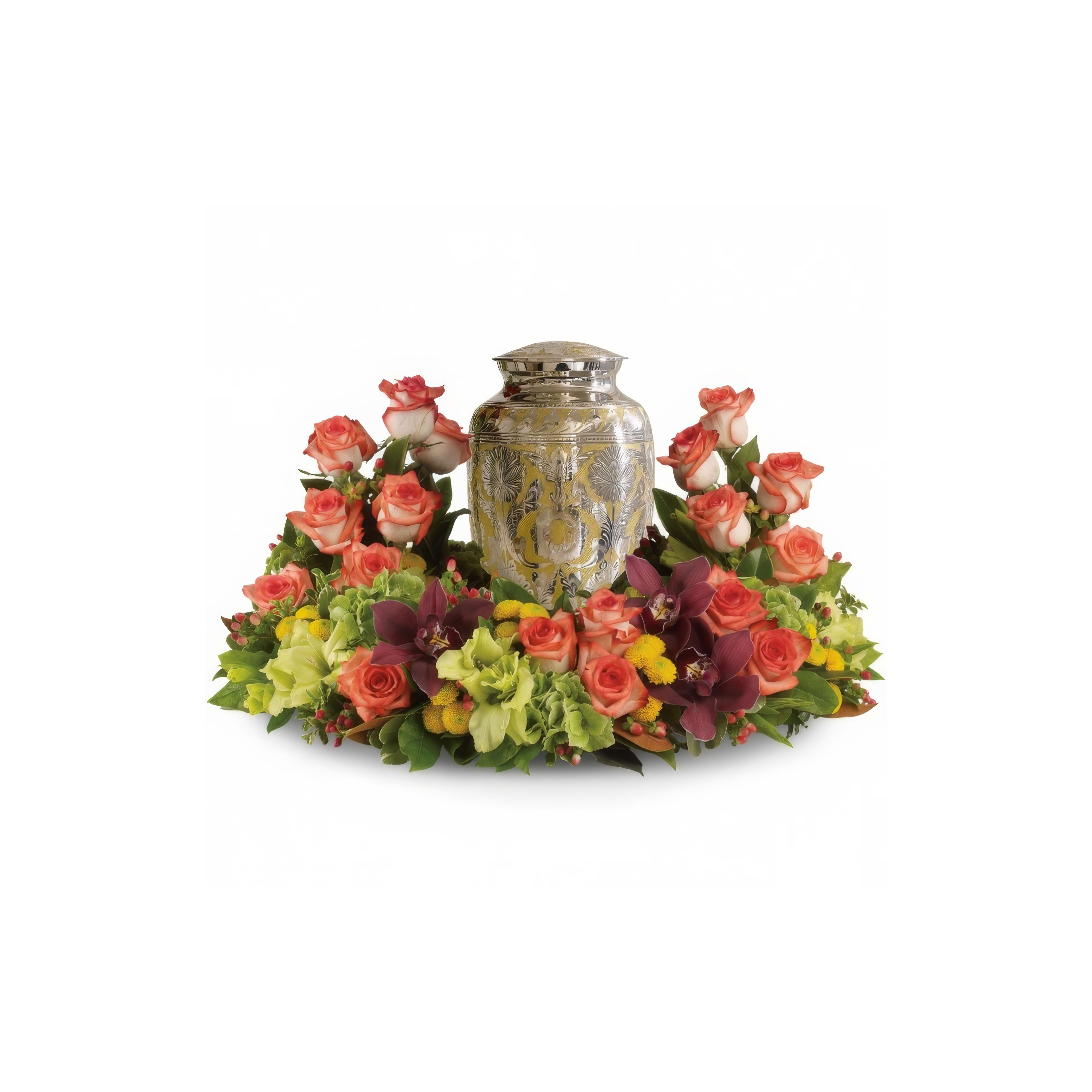 A decorative urn is elegantly surrounded by a colorful array of blooming roses and lush foliage.