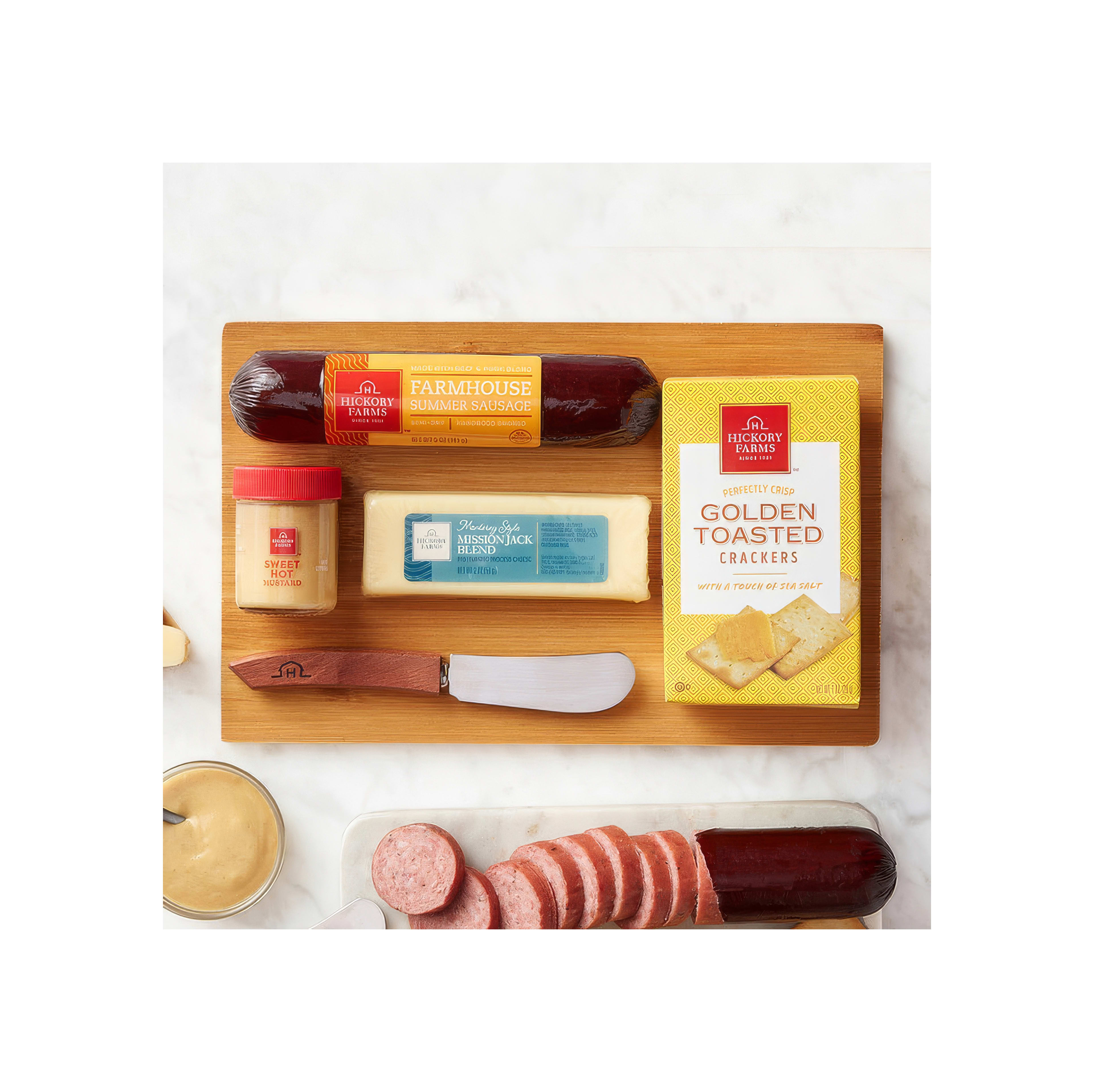 A selection of meats, cheese, crackers, and spreads displayed on a wooden board perfect for snacks.
