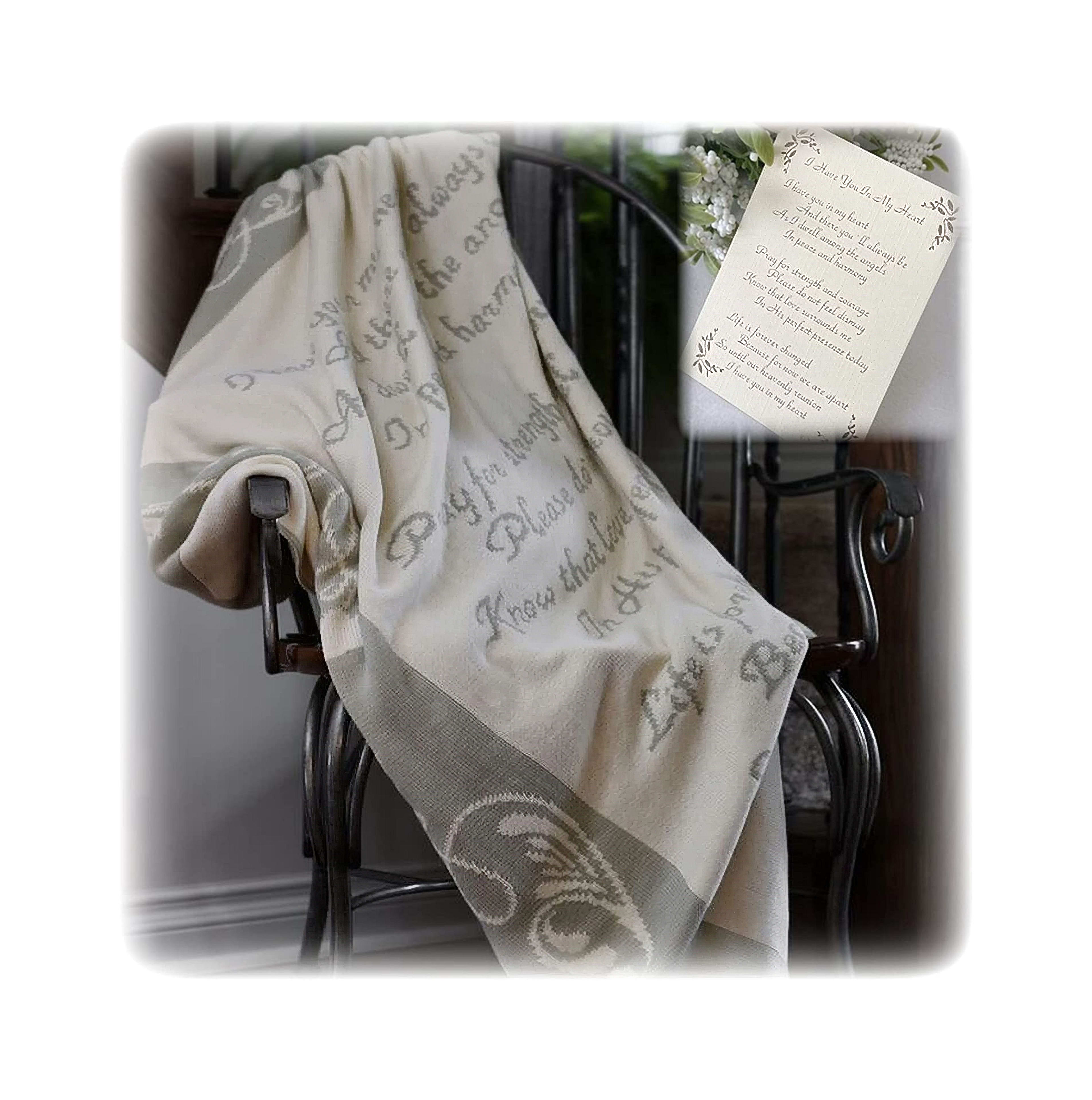 A soft throw is casually placed on a wooden chair, inviting relaxation in a warm, inviting room.