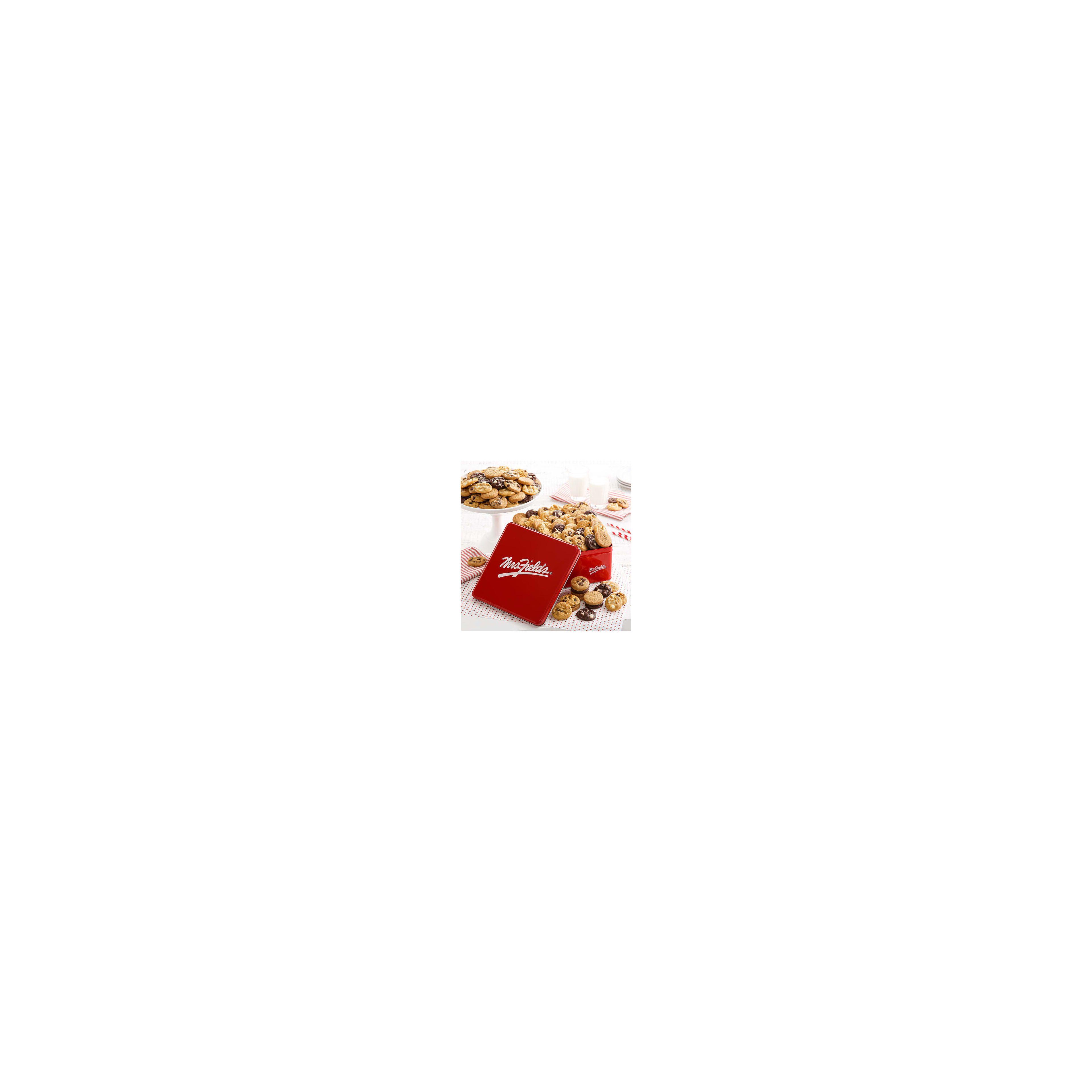 A variety of cookies are presented in a red tin, inviting guests to enjoy a delightful treat.