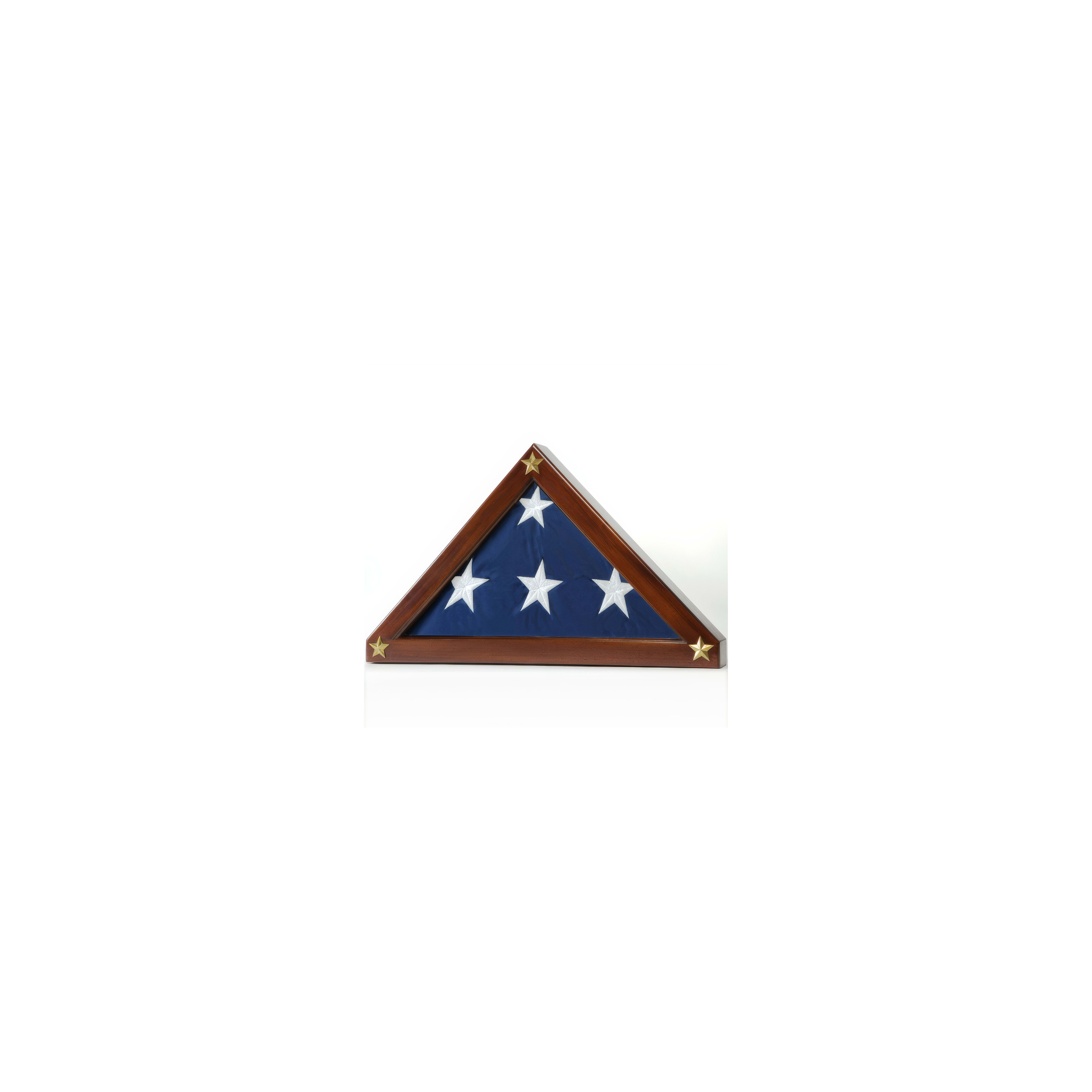 A folded American flag is displayed in a wooden triangular case adorned with stars.