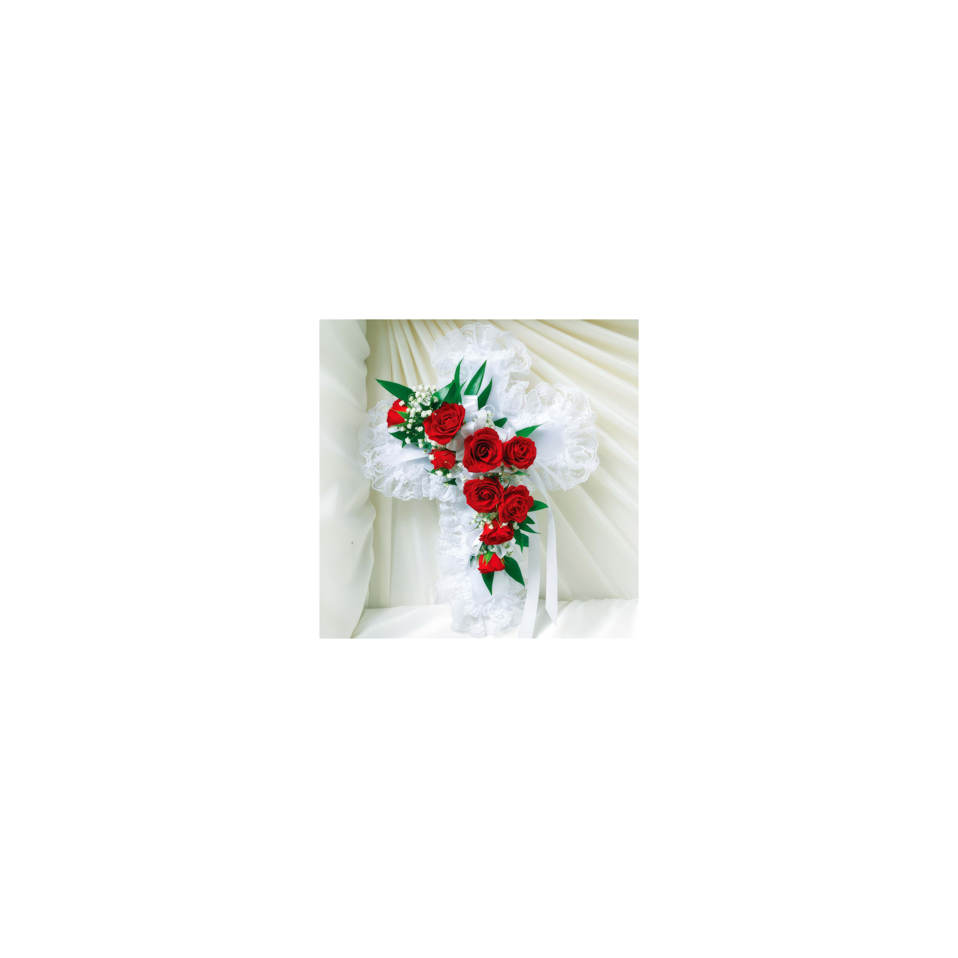 Elegant cross adorned with vibrant red roses and greenery, perfect for a memorial or ceremony.