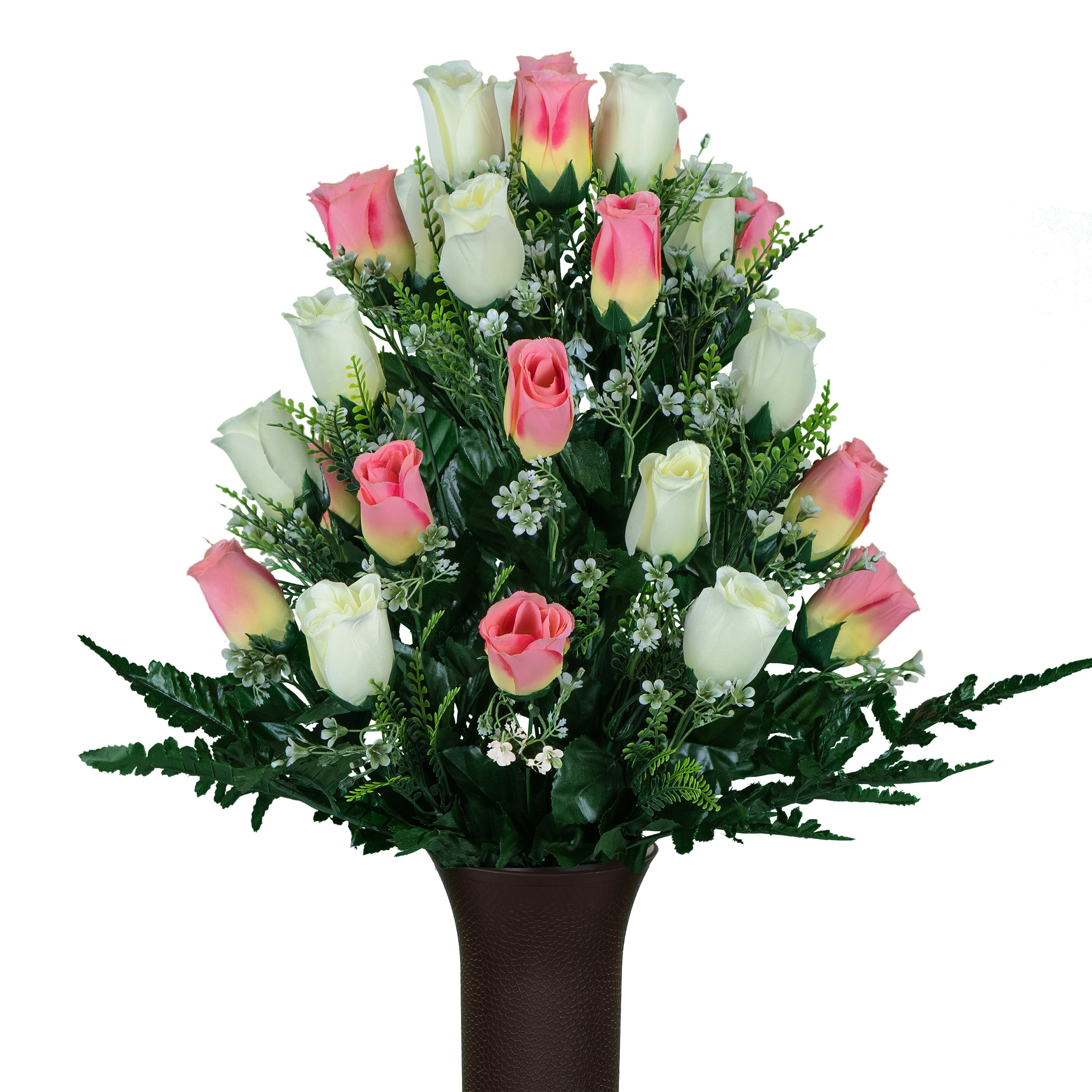 A vibrant bouquet features pink and white roses arranged elegantly in a decorative vase.