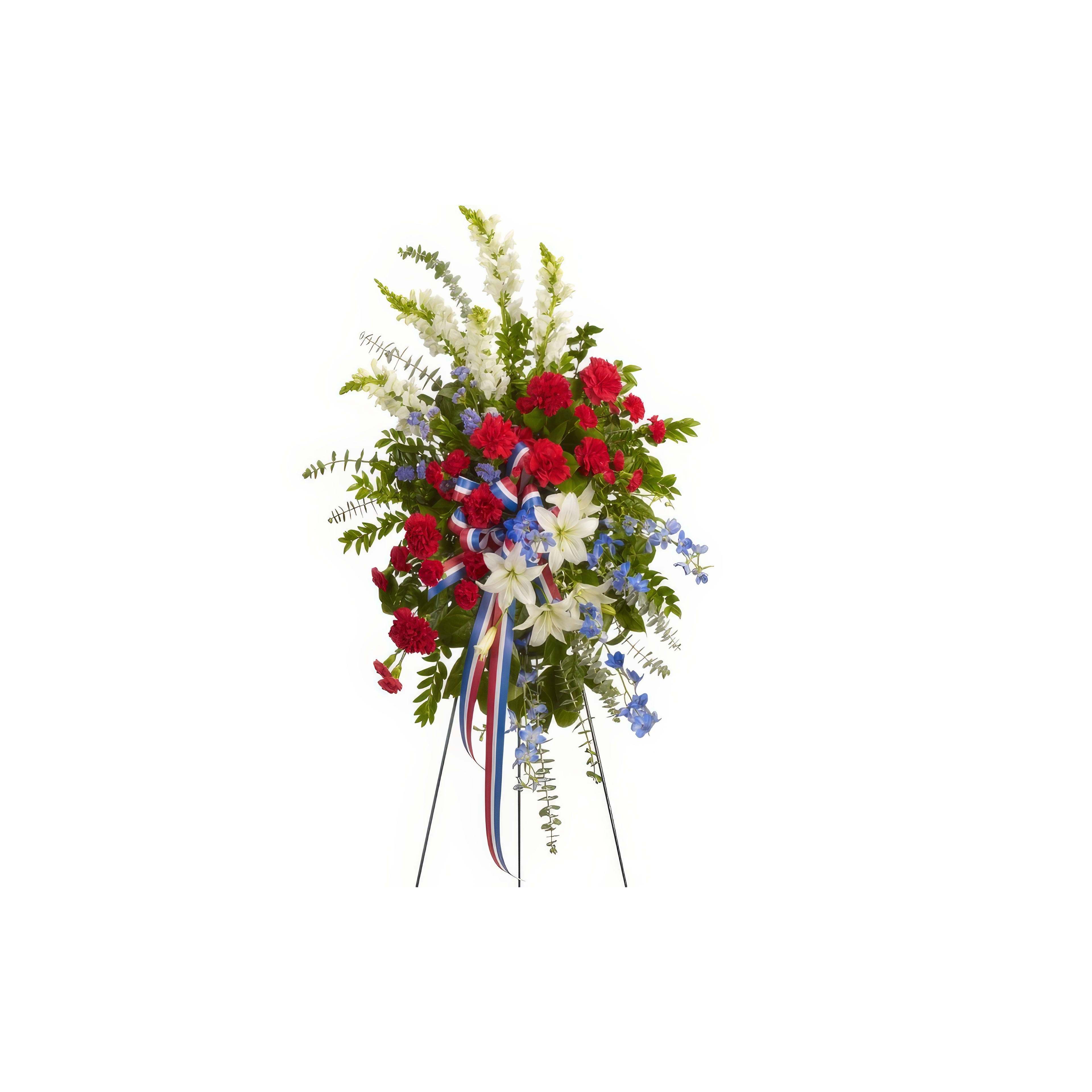 A beautiful floral tribute with roses, lilies, and ferns in patriotic colors.