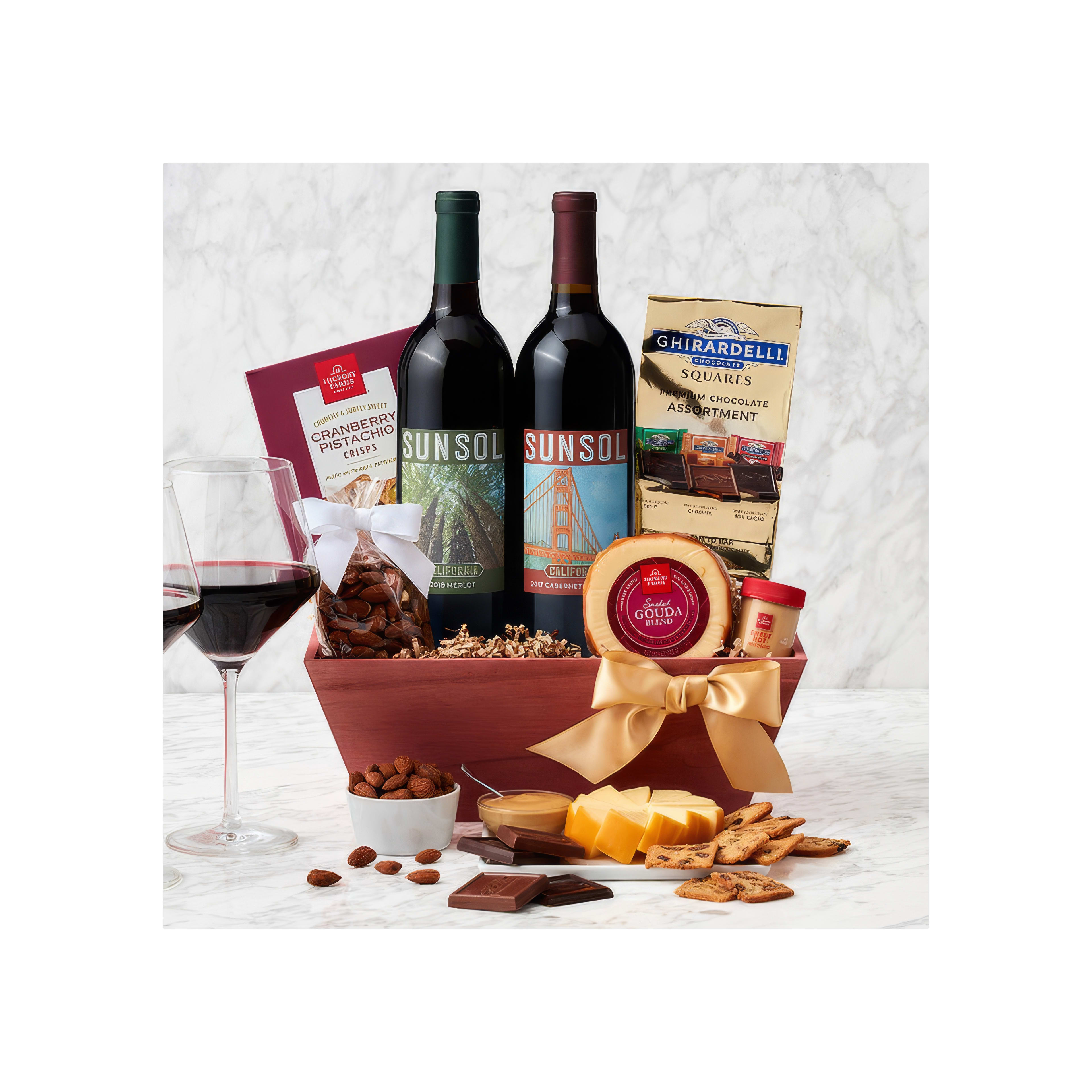 A stunning gift basket of red wine, chocolates, and gourmet snacks for any celebration.