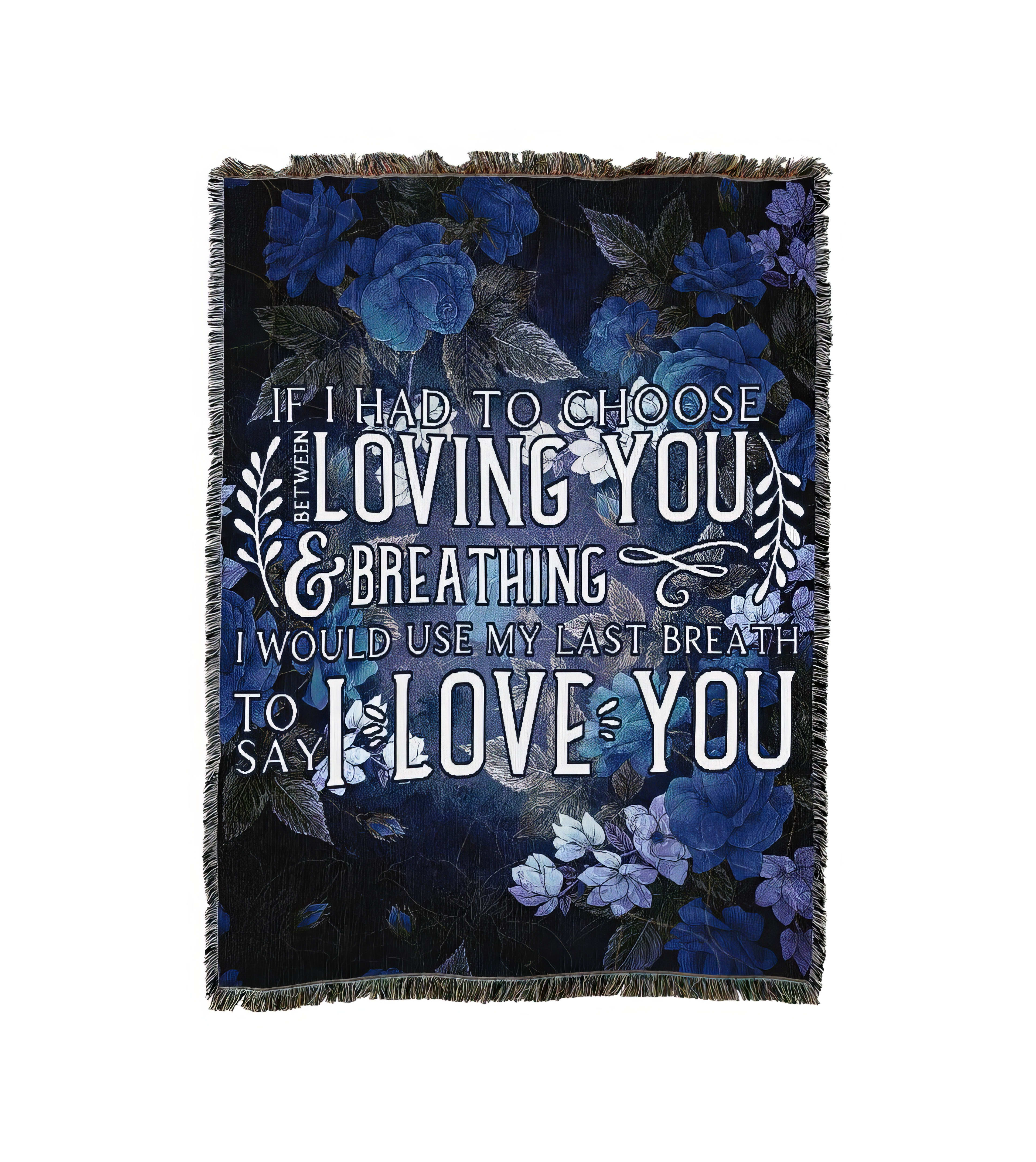A warm blanket features a heartfelt quote about love on a dark floral background.
