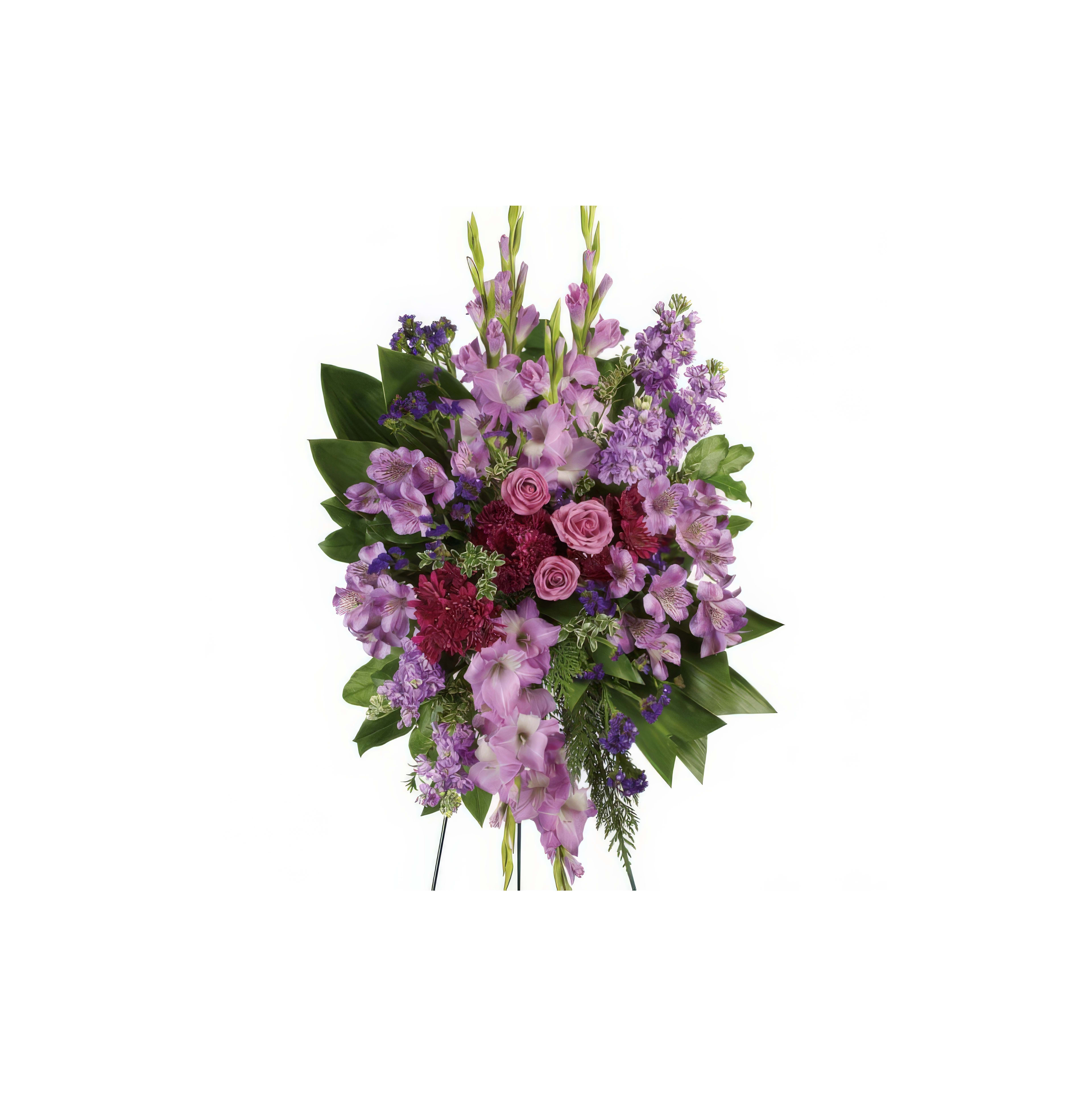 Lush bouquet of purple flowers with pink roses, arranged elegantly on a stand for a tribute.