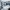 To skiløpere på topptur i snødekt fjellterreng med utsikt over en fjord og snødekte fjell i Stryn, Nordfjord.