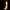 A person walking through the doorway of a tomb in Hegra near AlUla