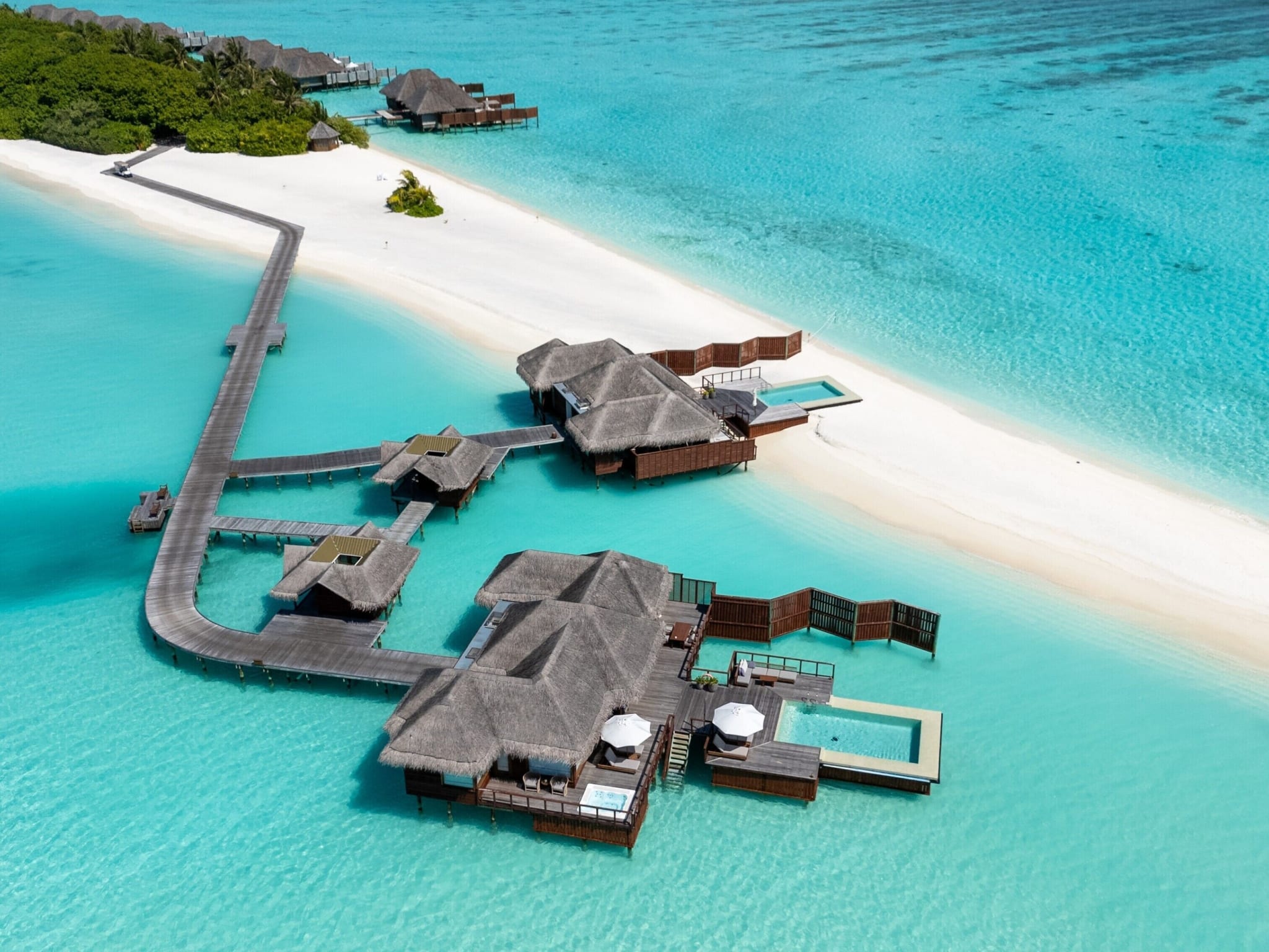 Jetty and white beach at Conrad Maldives Rangali Island from the air
