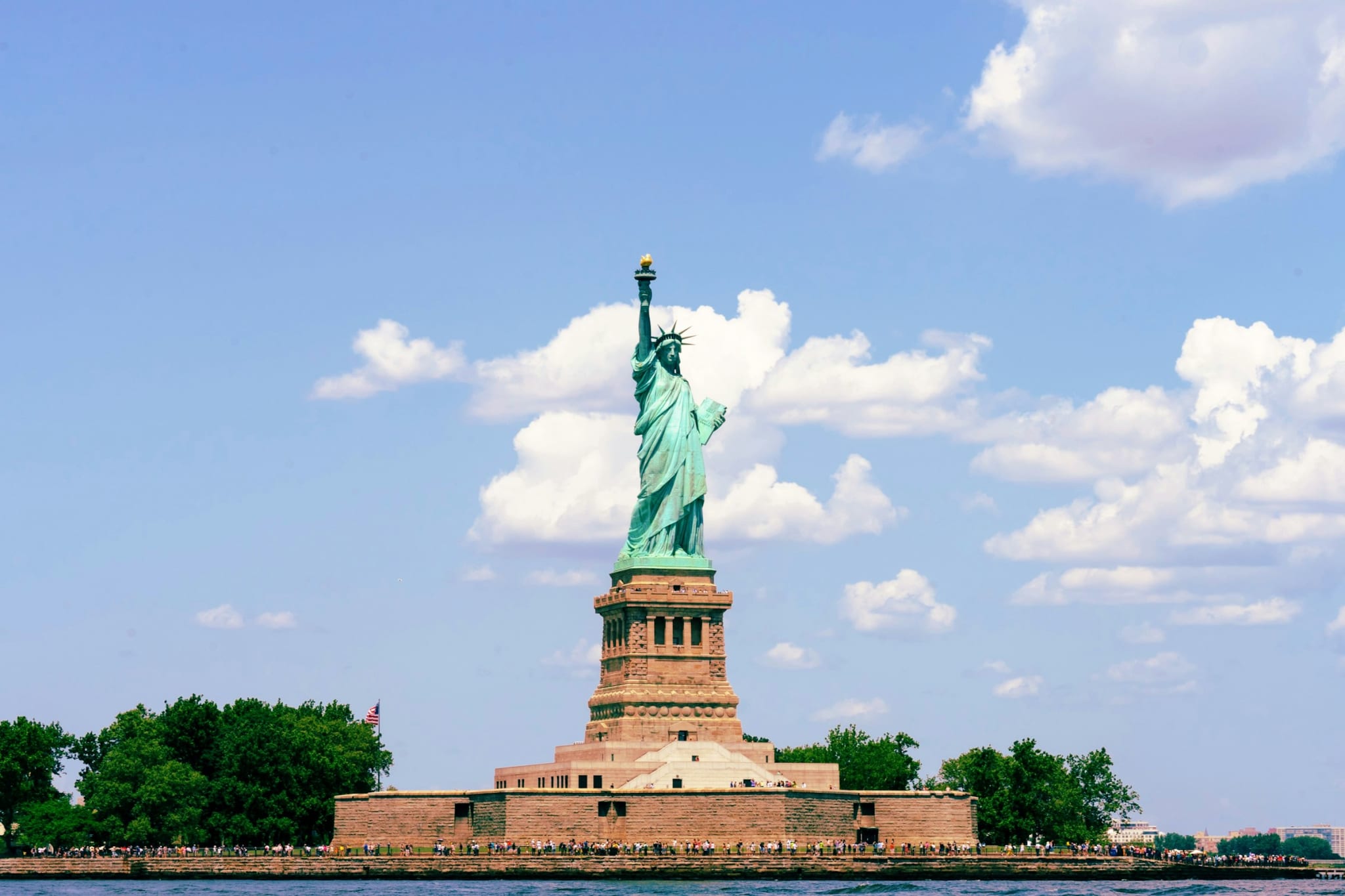 The Statue of Liberty against a blue sky in New York