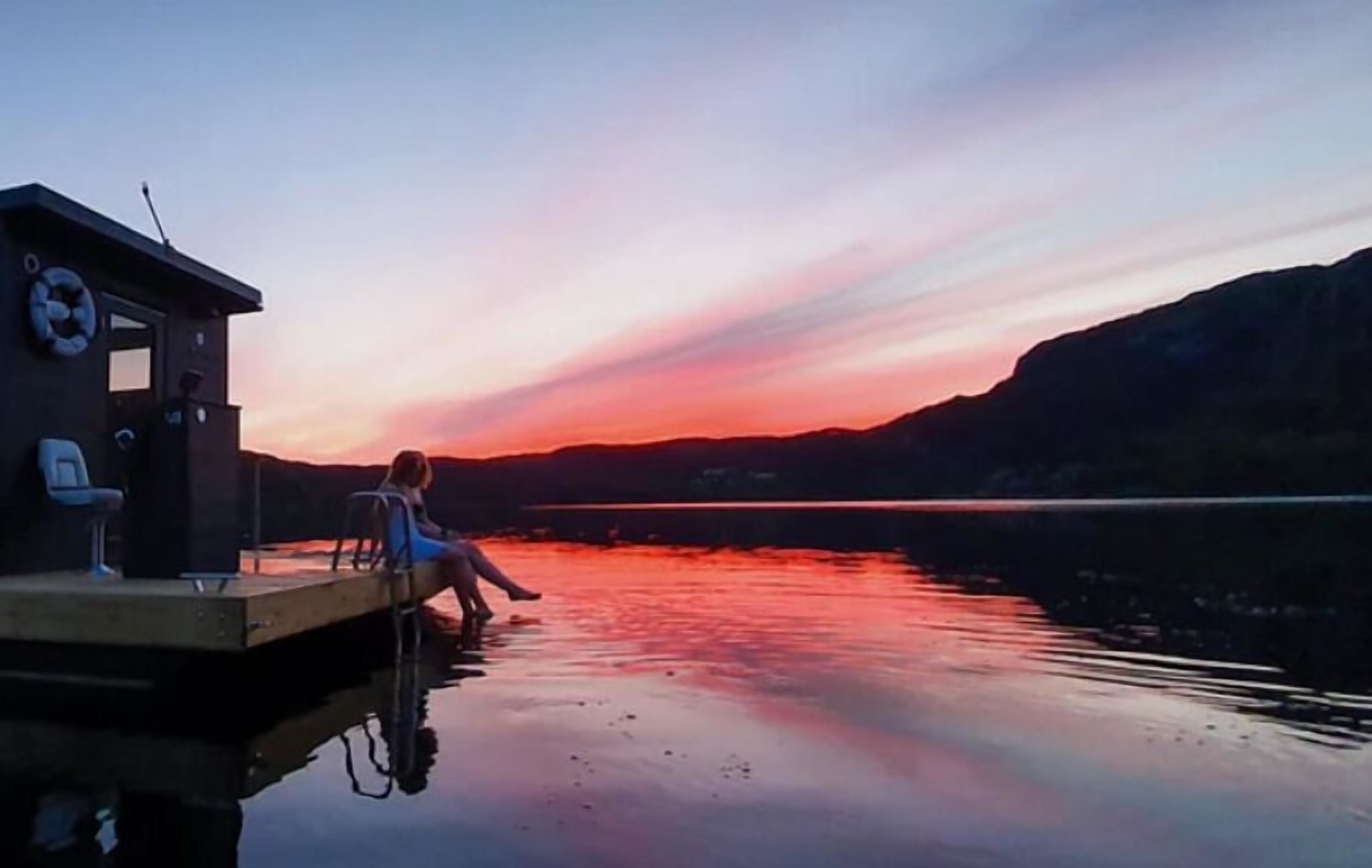 A mountain lake at sunset by Preikestolen