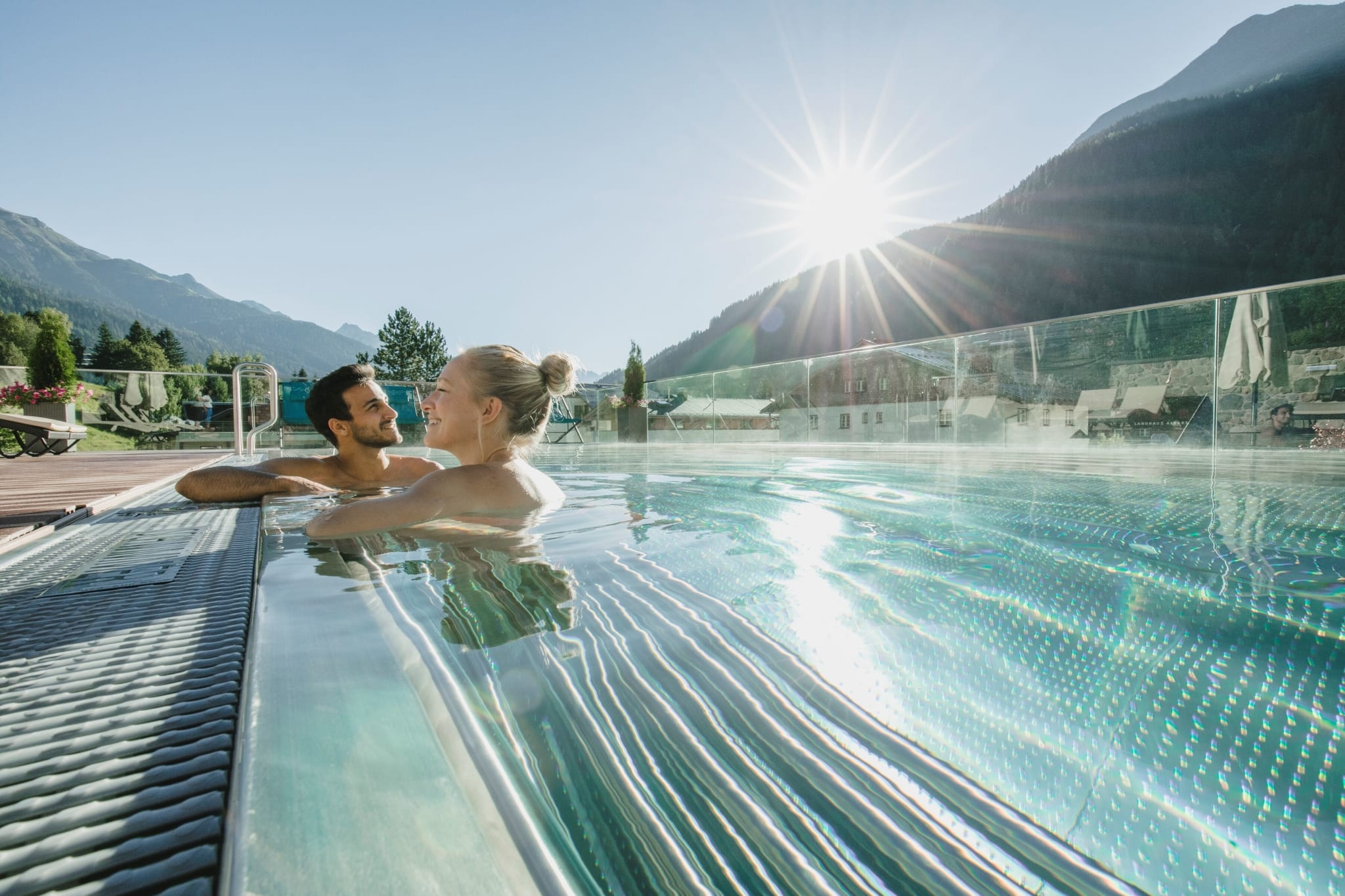 Outdoor pool with mountain views at Schwarzer Adler in St. Anton