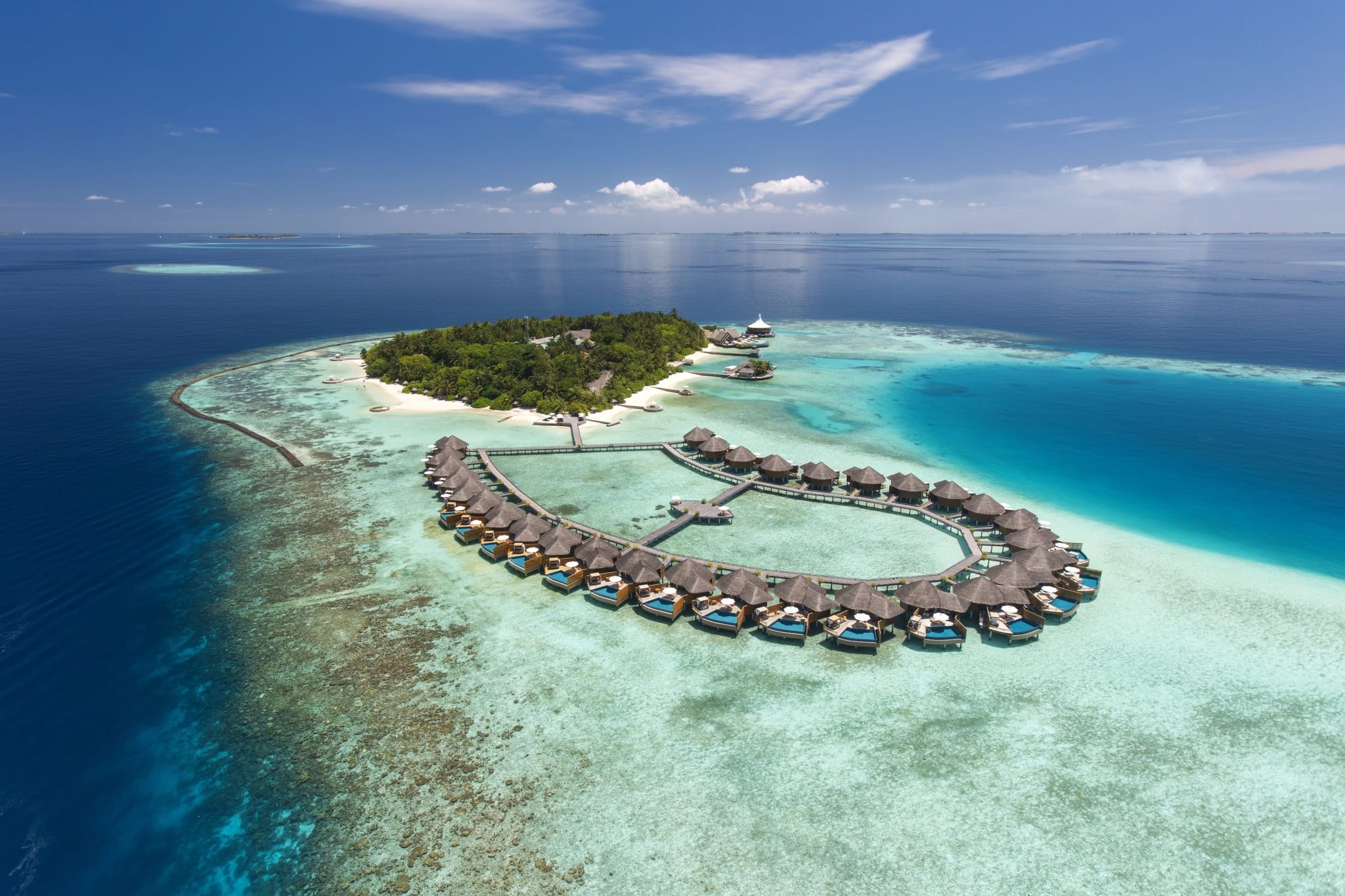 Baros island and its overwater villas from the air, Maldives