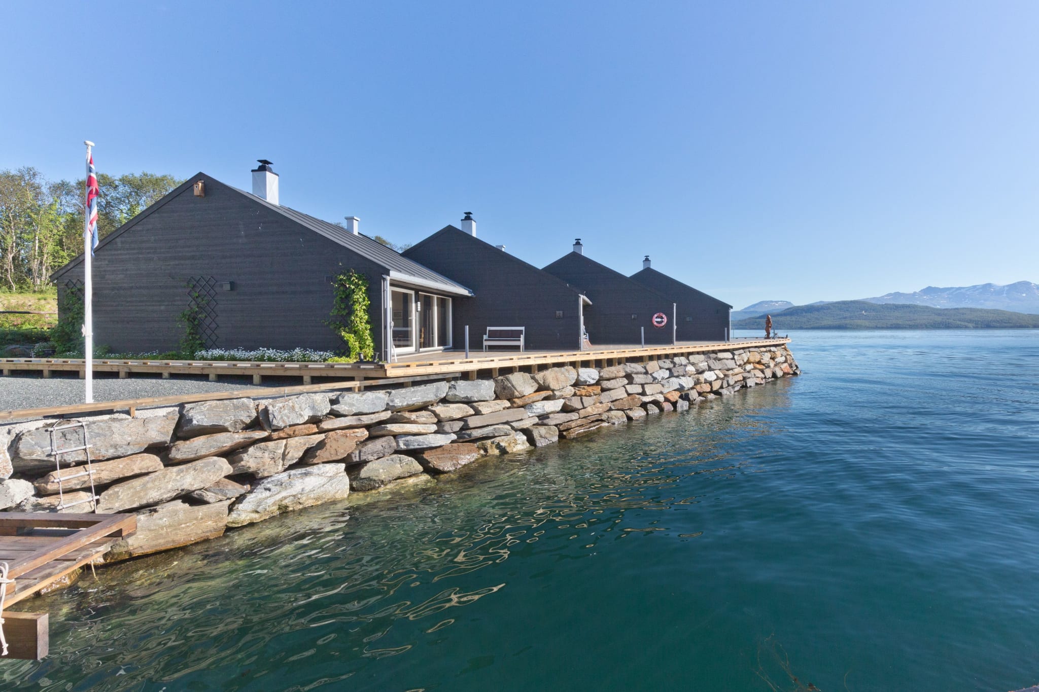 Wooden houses by the sea at Hotel Finsnes Gaard near Senja