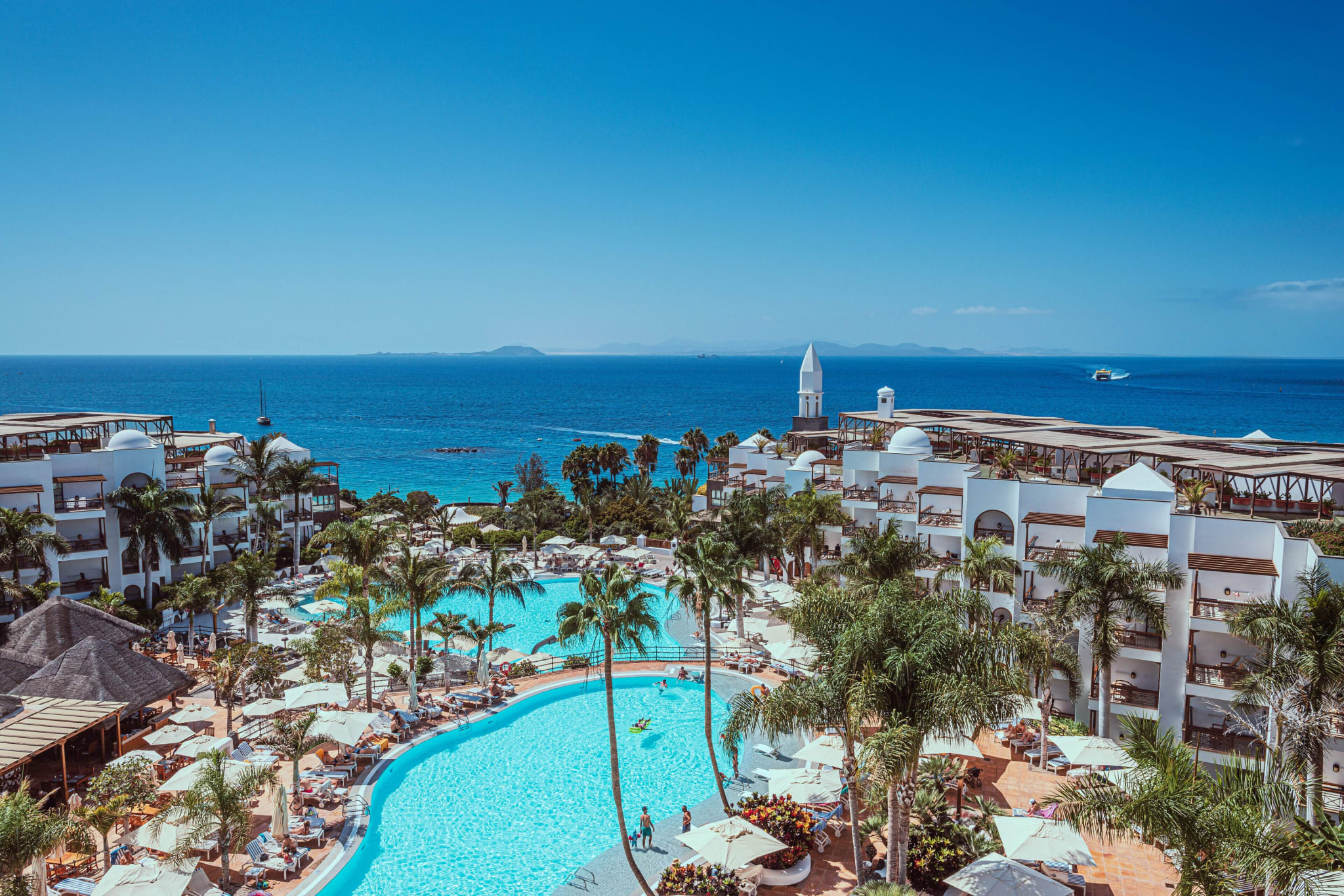 Pools and palms running down to the sea at Princesa Yaiza on Lanzarote