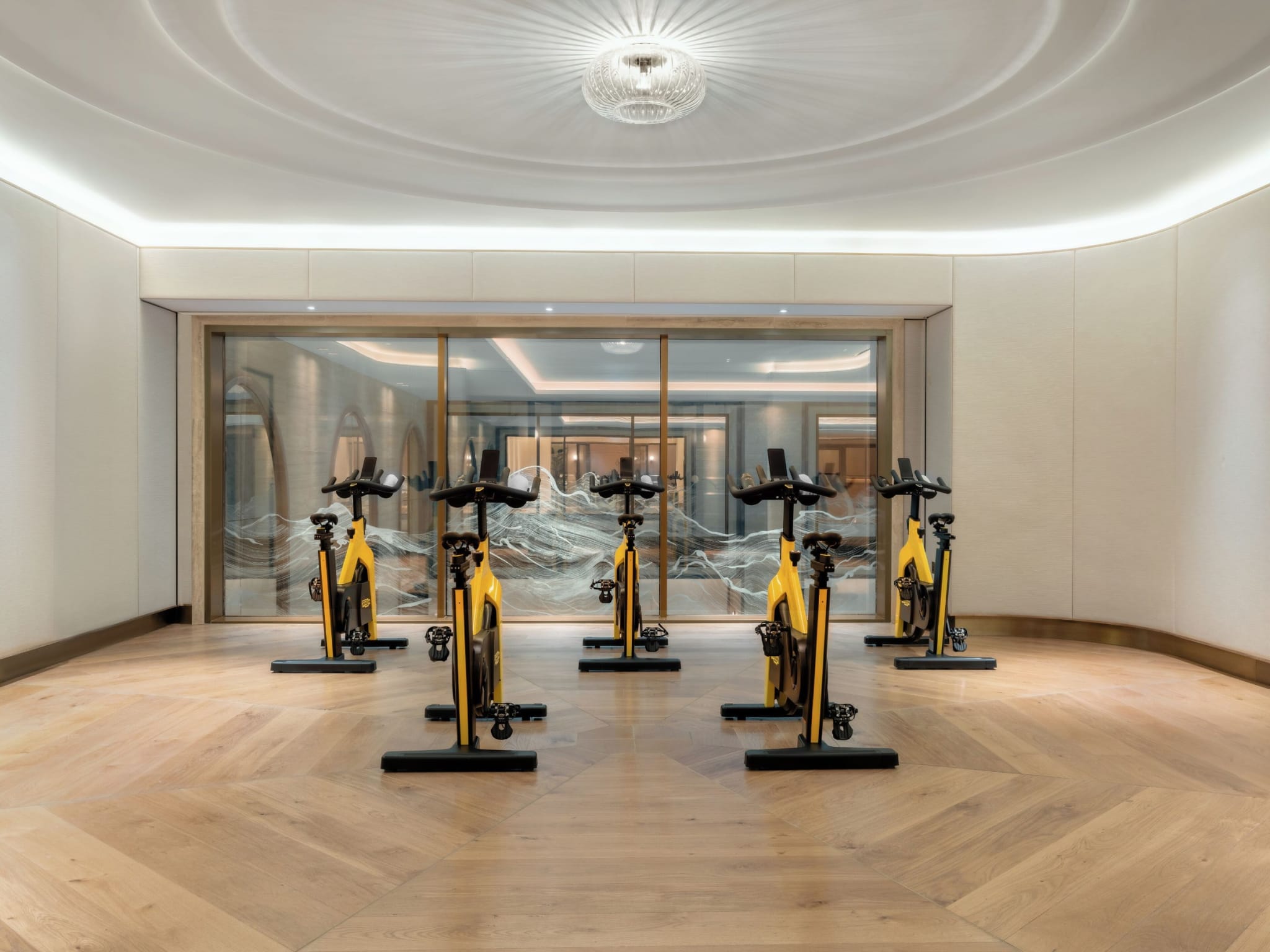 Bright lobby with columns and sculptures at Raffles London at The OWO, the former War Office