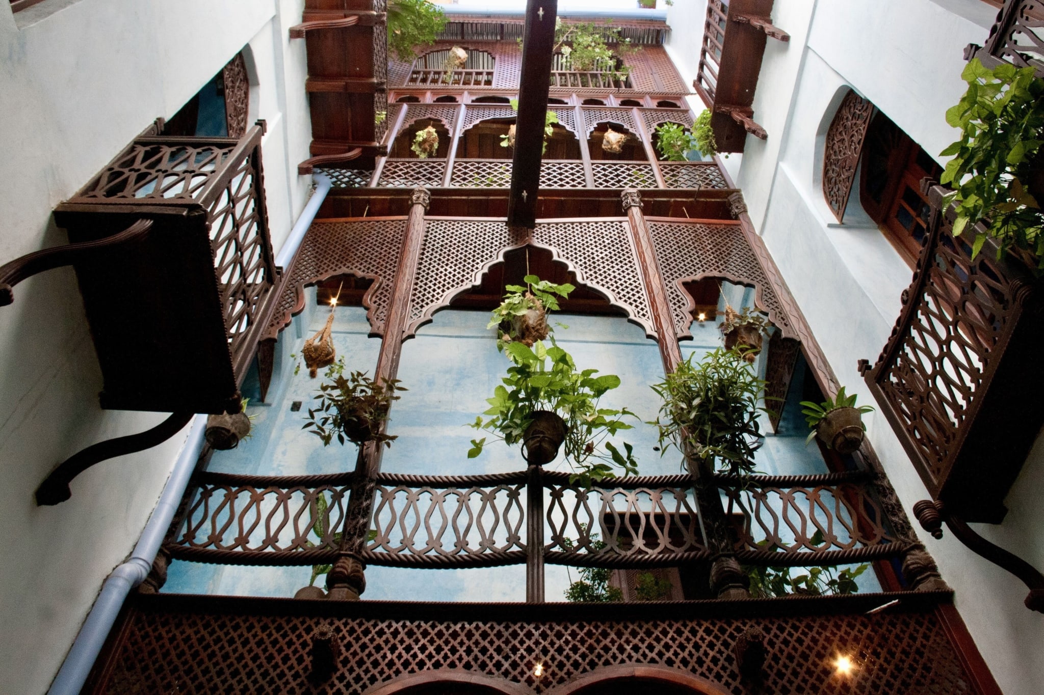 Courtyard with carved wooden galleries at Emerson Spice Hotel in Stone Town, Zanzibar