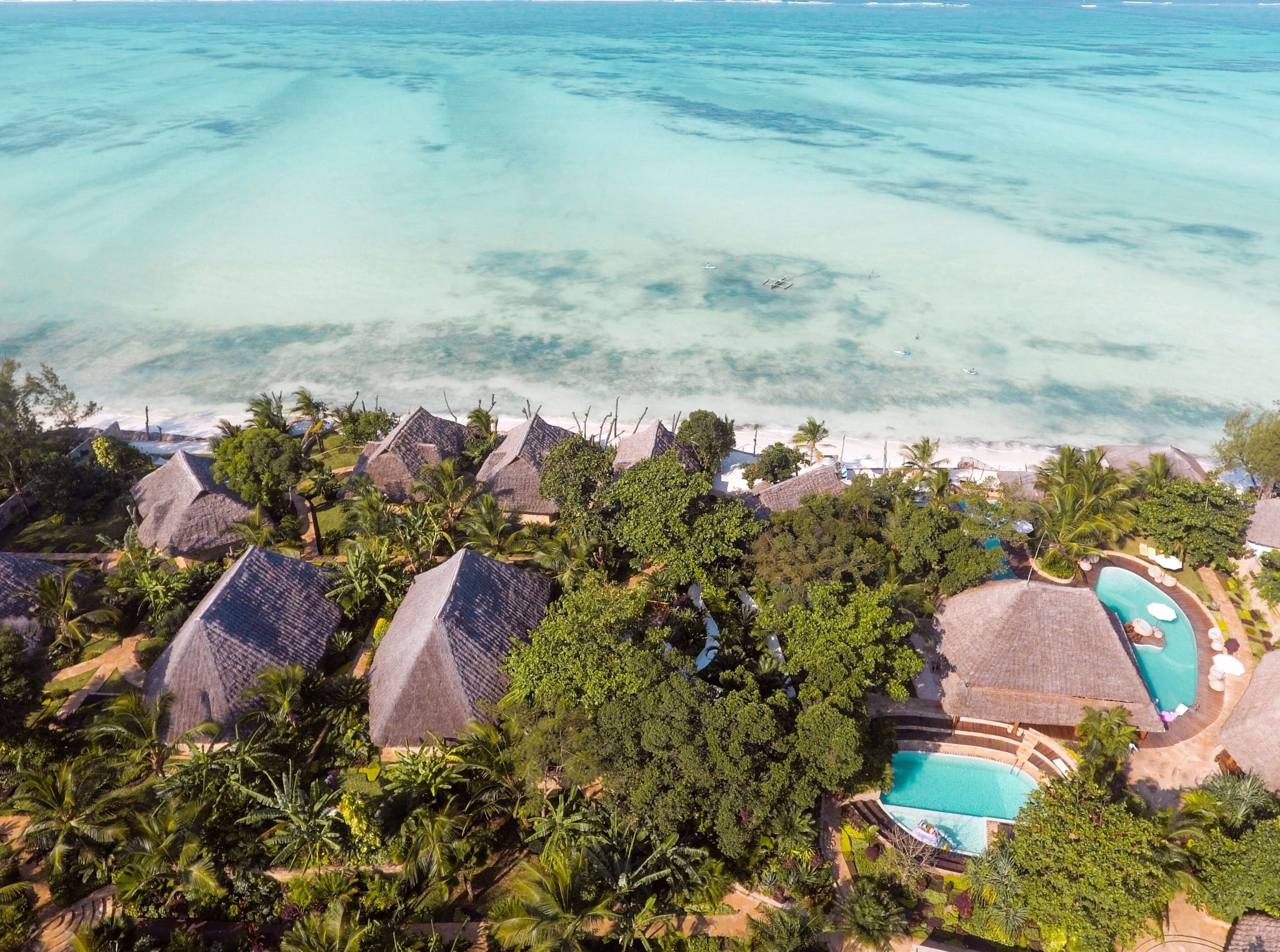 Turquoise reef and villas at Tulia Zanzibar in Pongwe on the east coast, seen from the air
