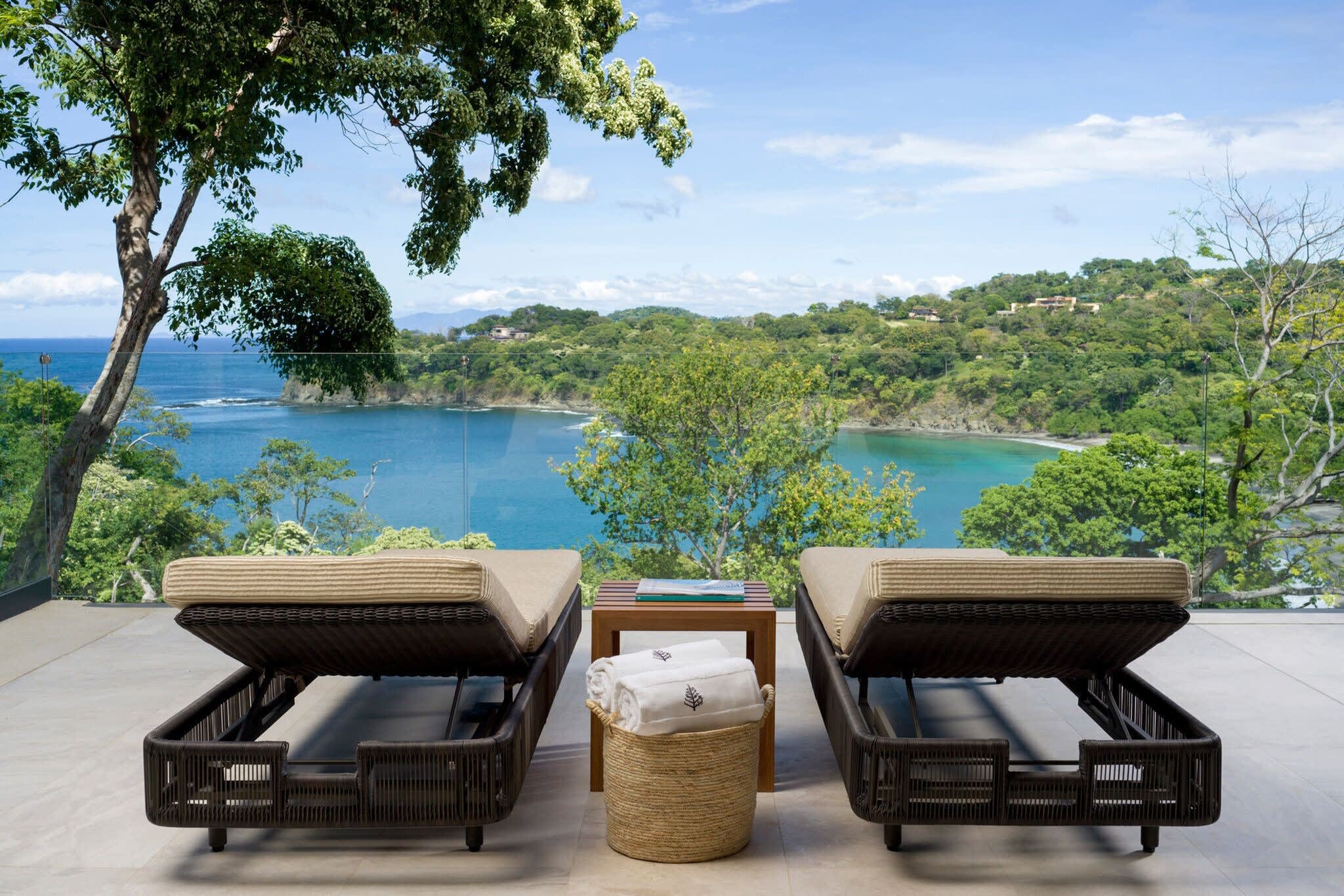 Sun loungers and bay at Four Seasons Peninsula Papagayo in Guanacaste