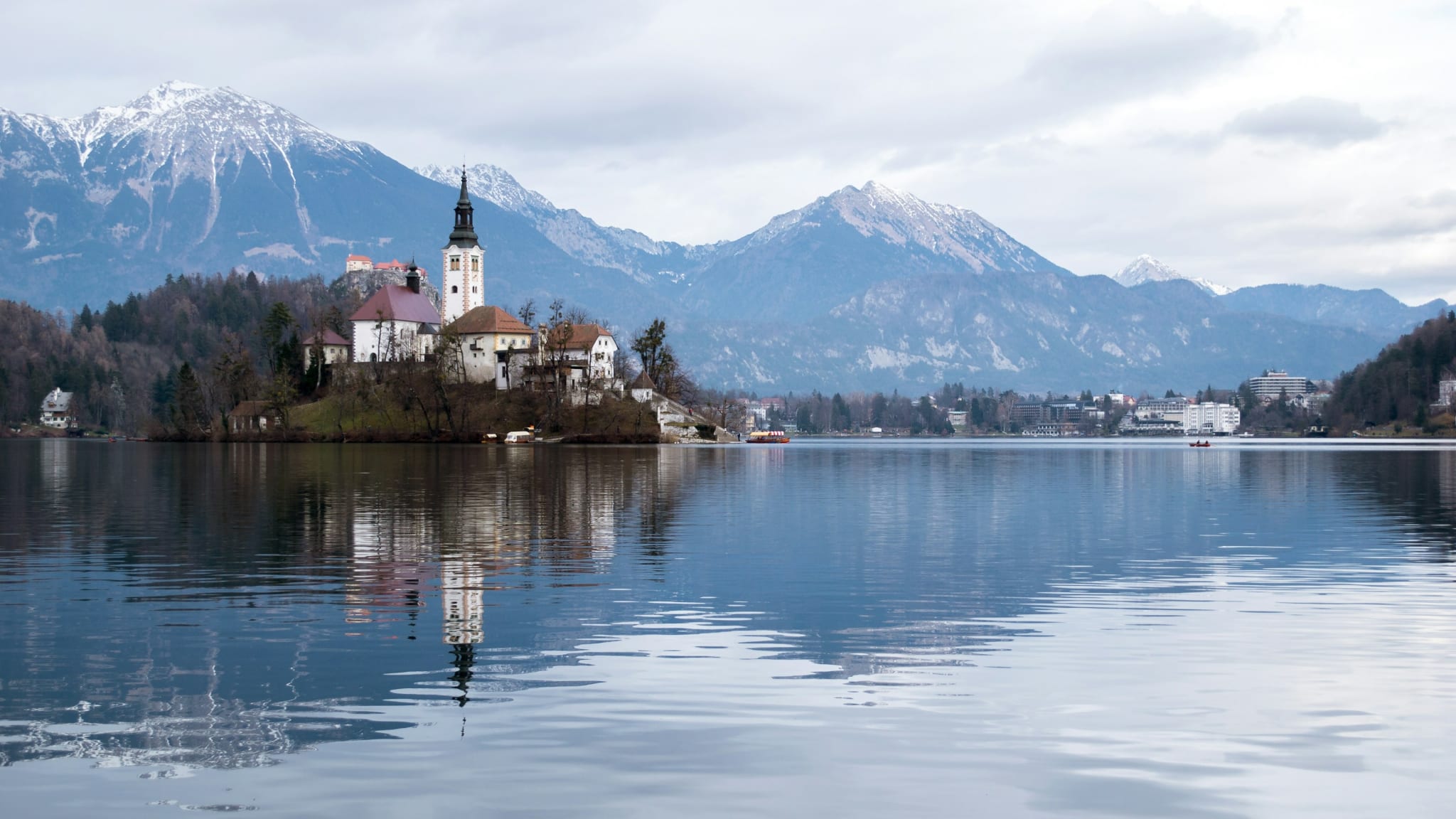 The island church in Lake Bled with the Alps behind