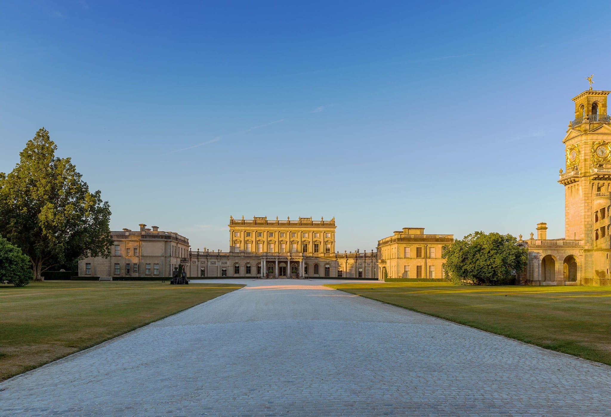 The avenue leading up to Cliveden House above the Thames in evening light