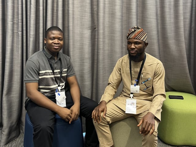 with a fellow scholar