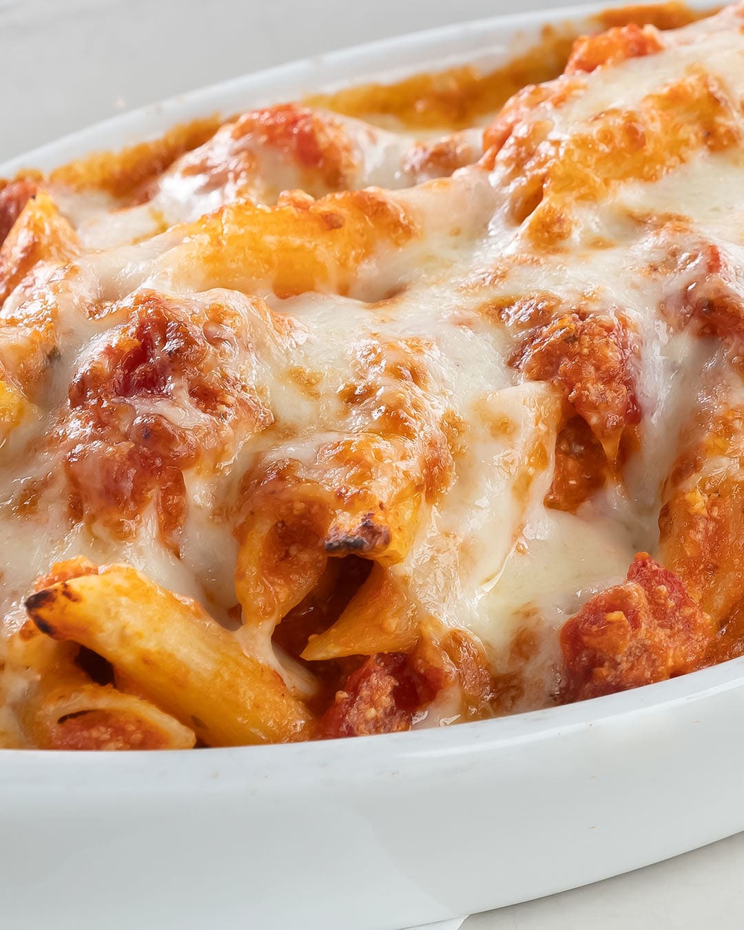 Baked ziti inside white bowl