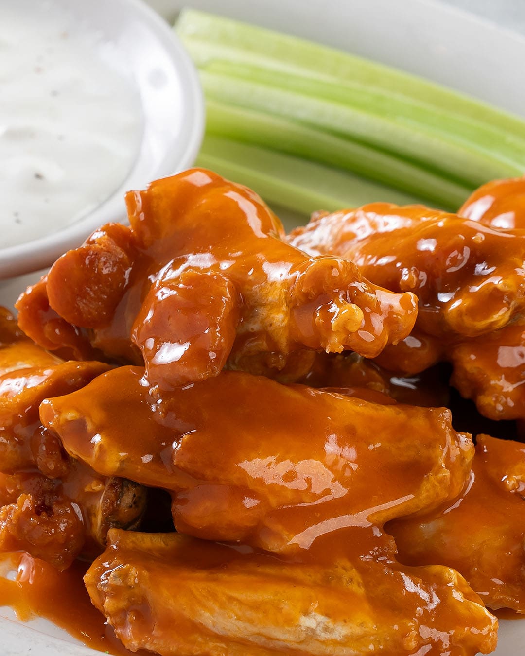 Bone in buffalo wings with celery and blue cheese sauce