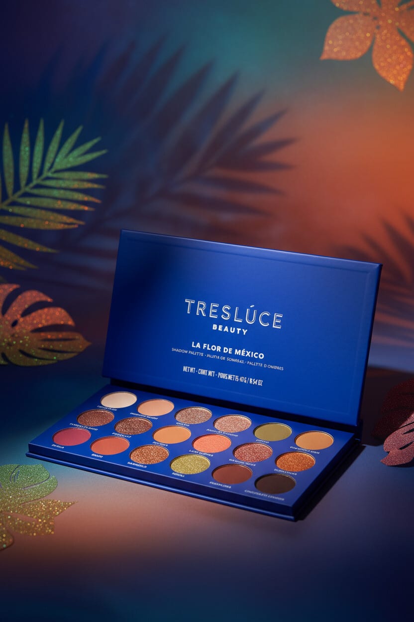 Treslúce eyeshadow palette in teal and amber dusk light with palm leaf shadows