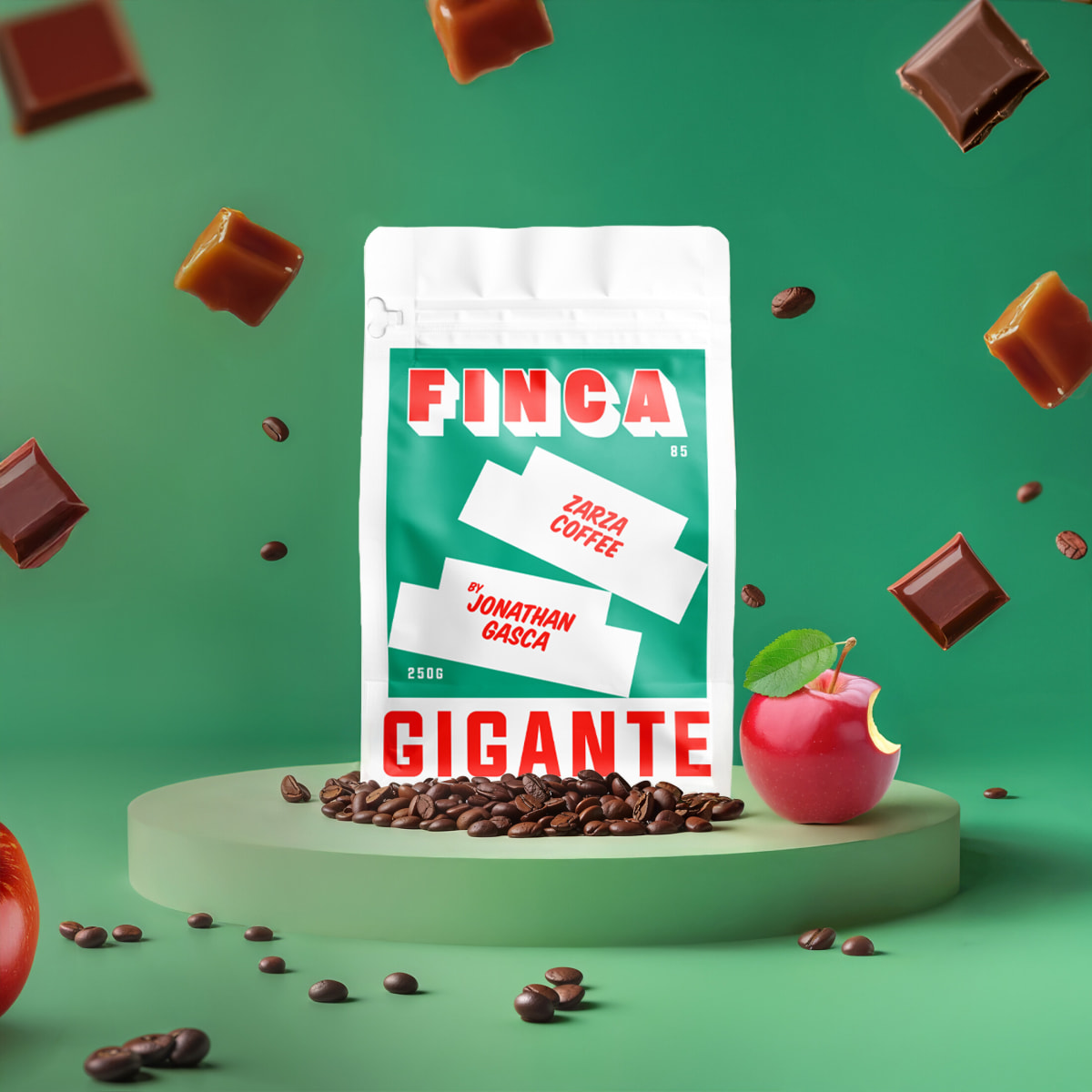 Green Gigante Finca coffee bag on a green podium with flying caramel cubes and apple