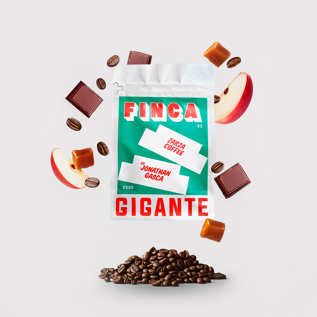 Green Gigante Finca coffee bag with flying apple slices, chocolate and caramel on grey