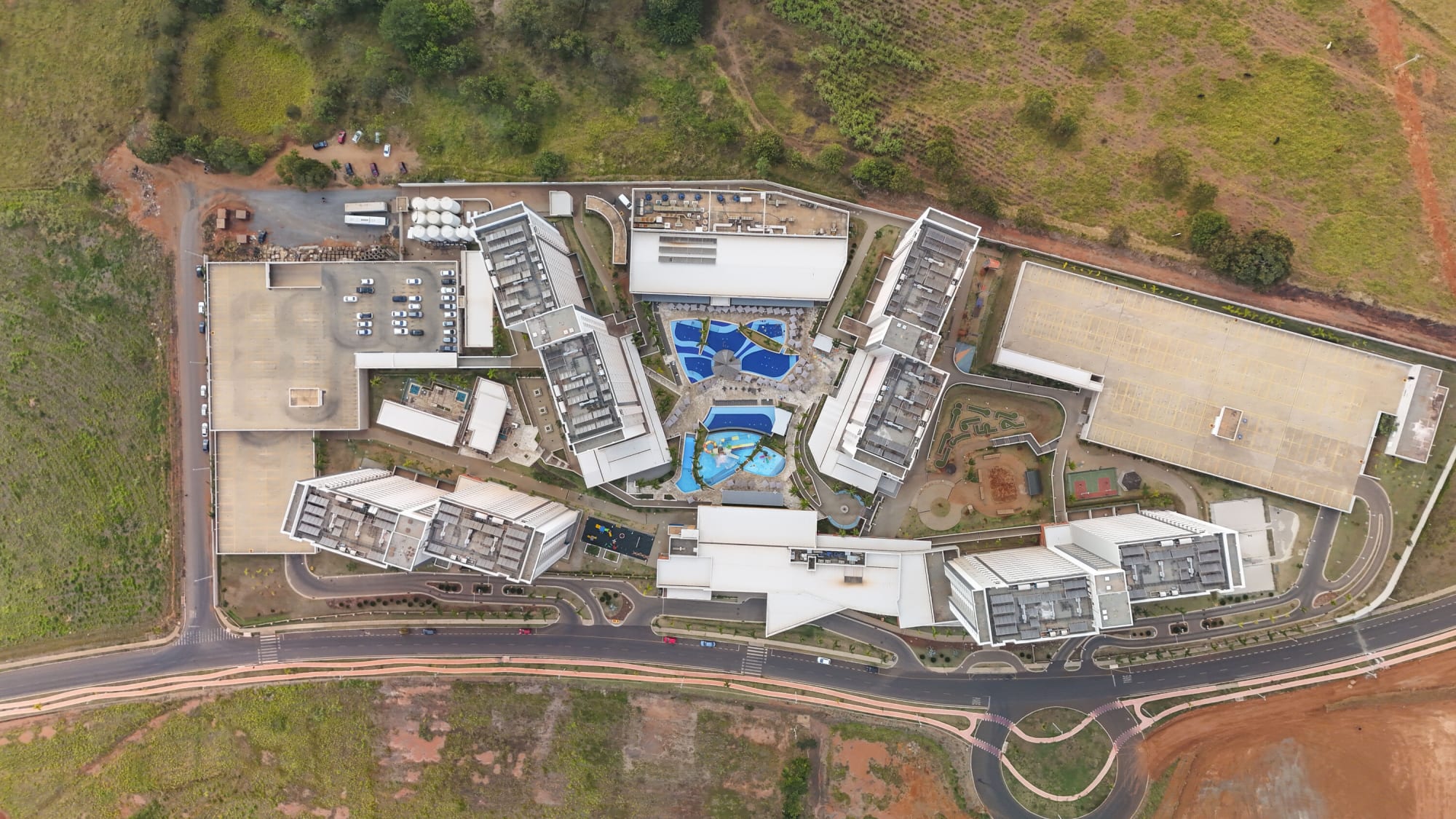Aerial view of the Enjoy Solar resort complex amid red earth and fields