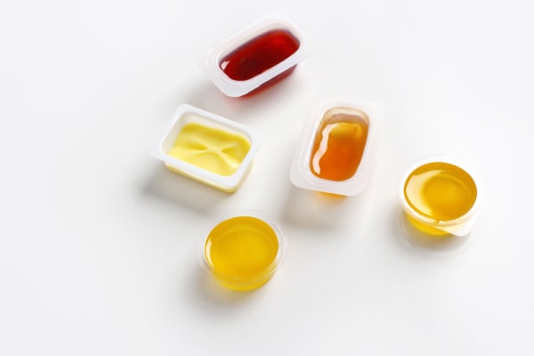 Zur Abgabepflicht für Portionsverpackungen vom Frühstücksbuffet und Getränkebecher