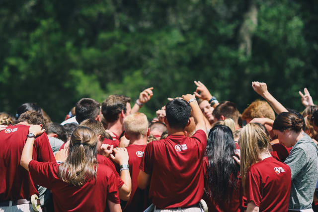 Staff Praying in a Huddle