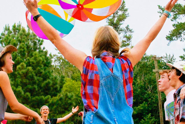 teenage family campers playing a game at the rodeo