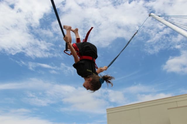 Girl flips on euro-jump at Fellowship of the Parks.