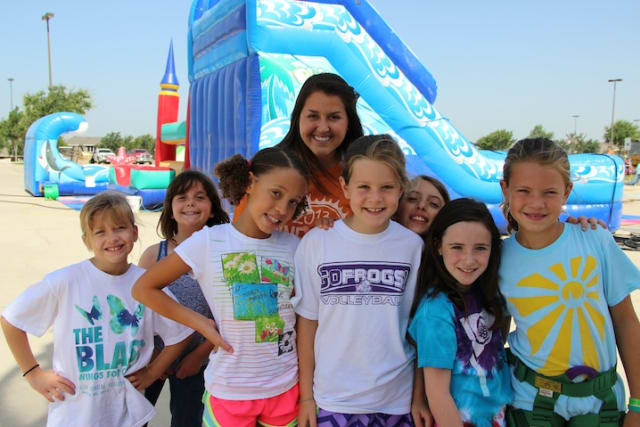 Campers in front of water slide