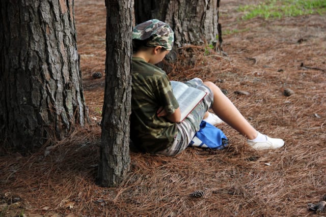 Camper Reading the Bible