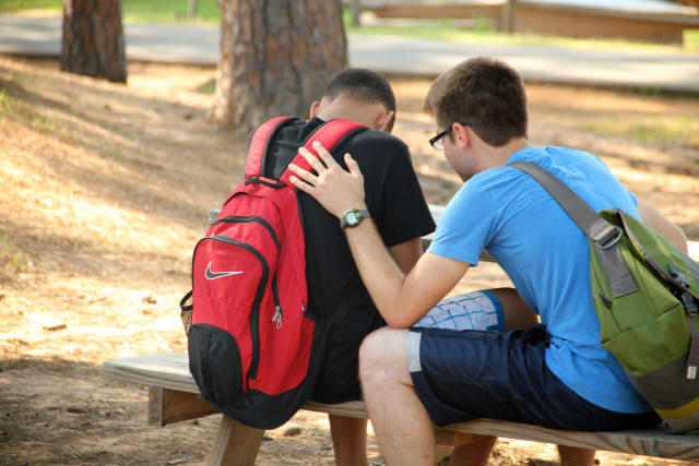 Camper and Counselor Praying