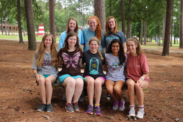 Campers sitting on a bench