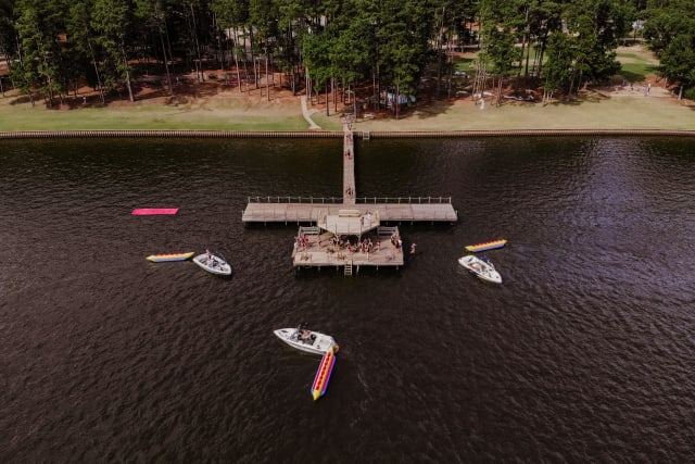 Drone shot of boats in the lake by the dock