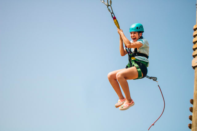 Girl campers hanging out enjoying camp in rocking chairs